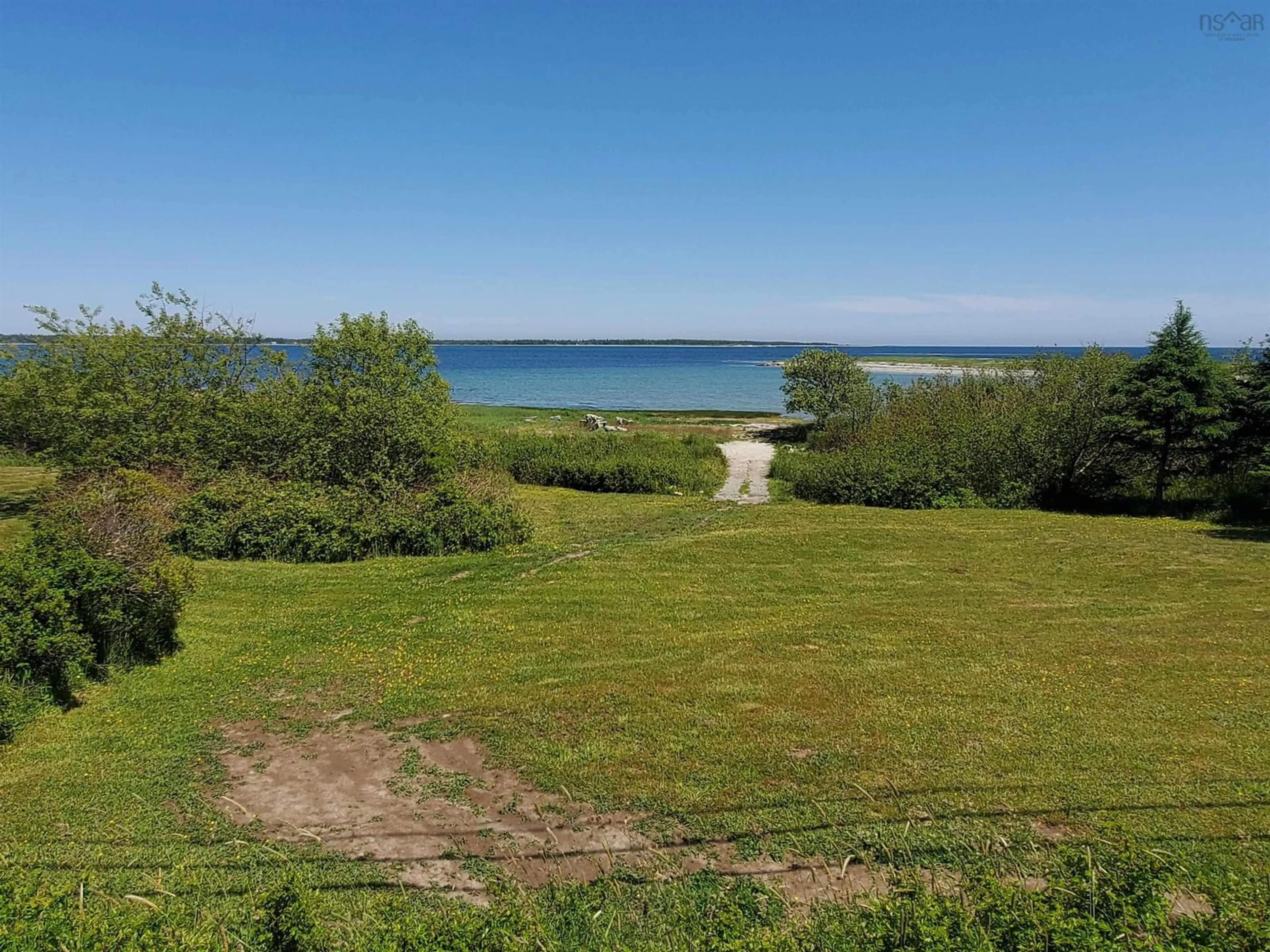 A pic from outside/outdoor area/front of a property/back of a property/a pic from drone, water/lake/river/ocean view for 5096 Shore Rd, North East Harbour Nova Scotia B0T 1W0