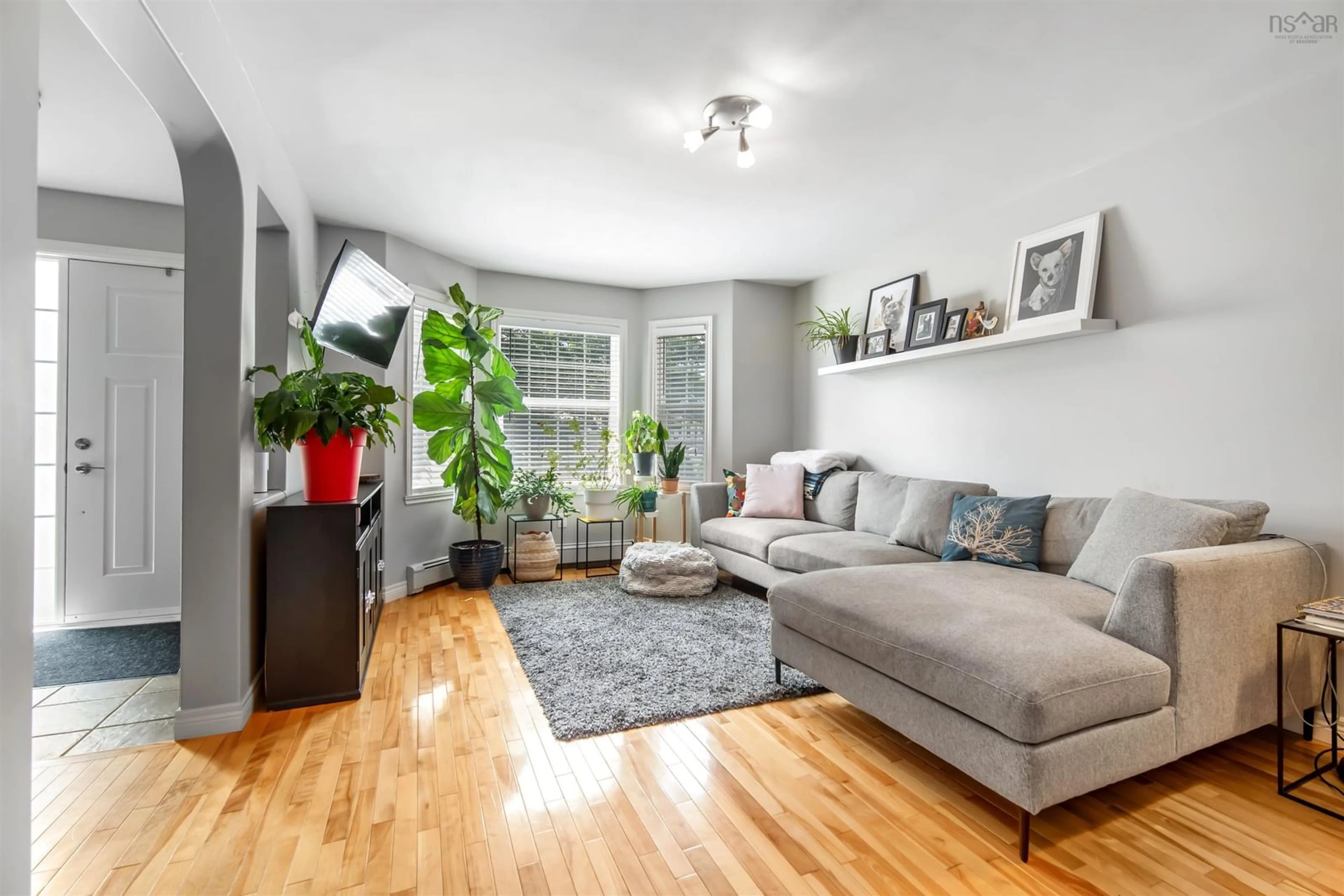 Living room with furniture, wood/laminate floor for 1 Walter Havill Dr, Armdale Nova Scotia B3N 3H4