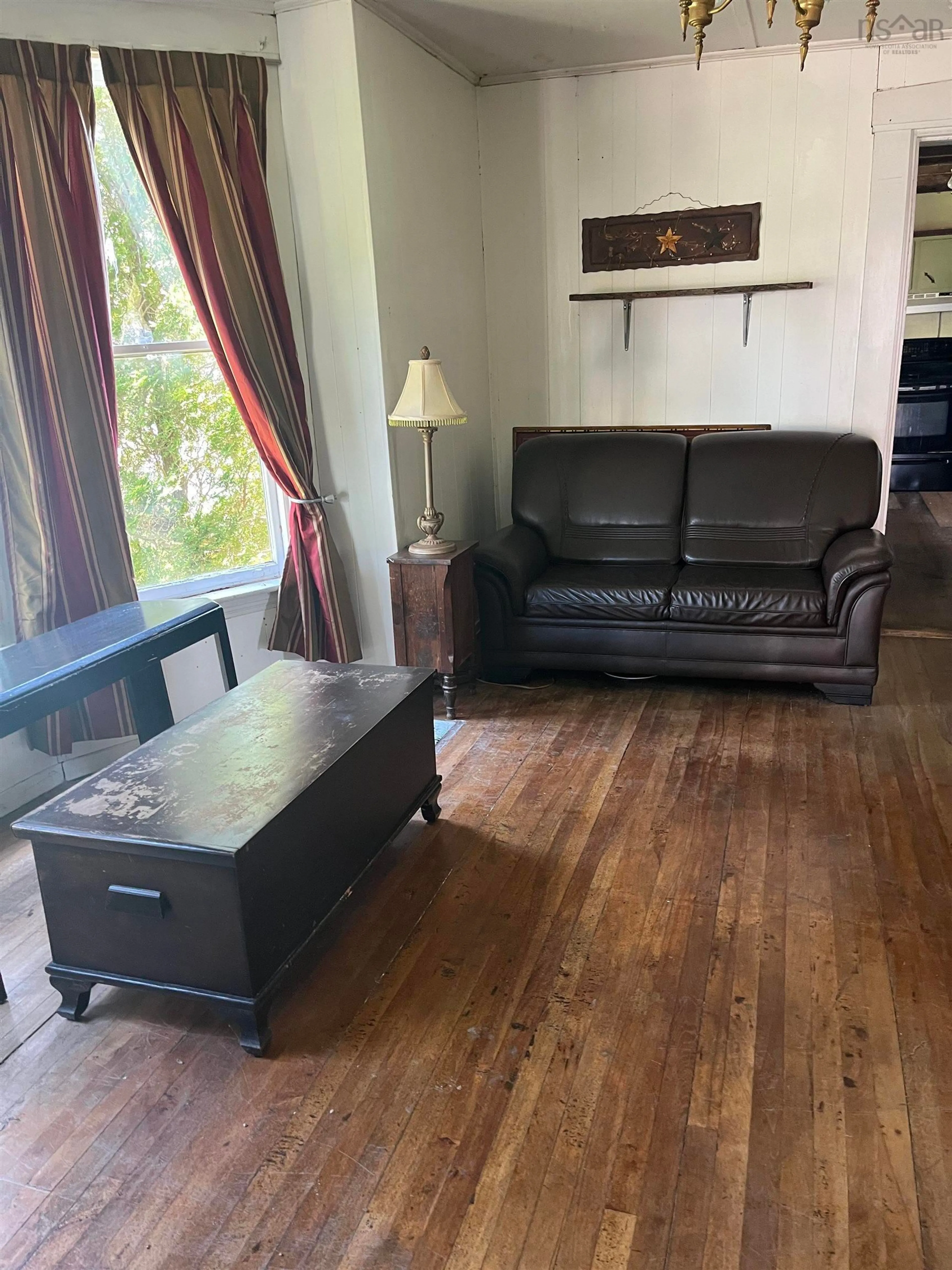 Living room with furniture, wood/laminate floor for 220 Granville St, Bridgetown Nova Scotia B0S 1C0