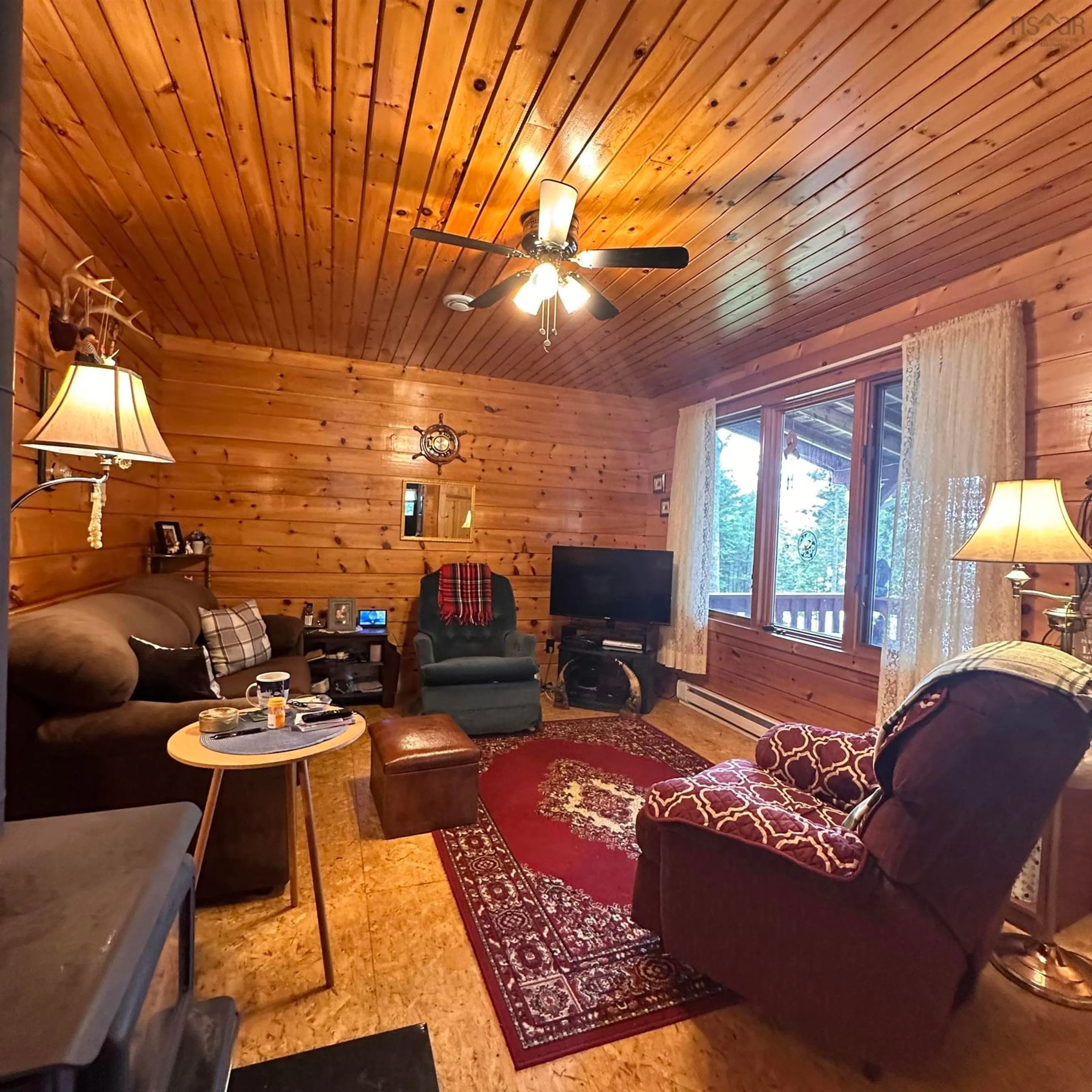 Living room with furniture, wood/laminate floor for 256 Dean Lake Rd, Westfield Nova Scotia B0T 1B0