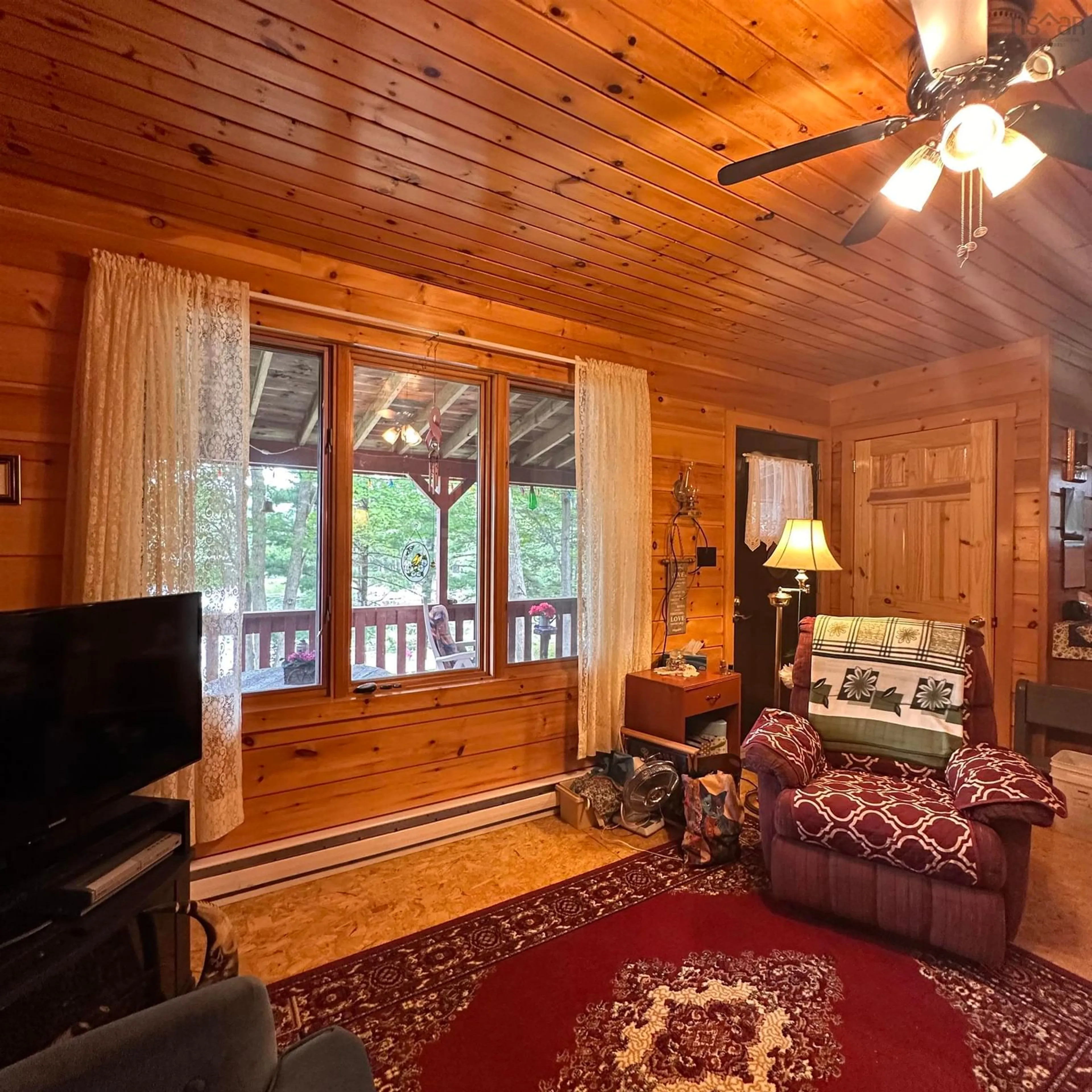 Living room with furniture, wood/laminate floor for 256 Dean Lake Rd, Westfield Nova Scotia B0T 1B0