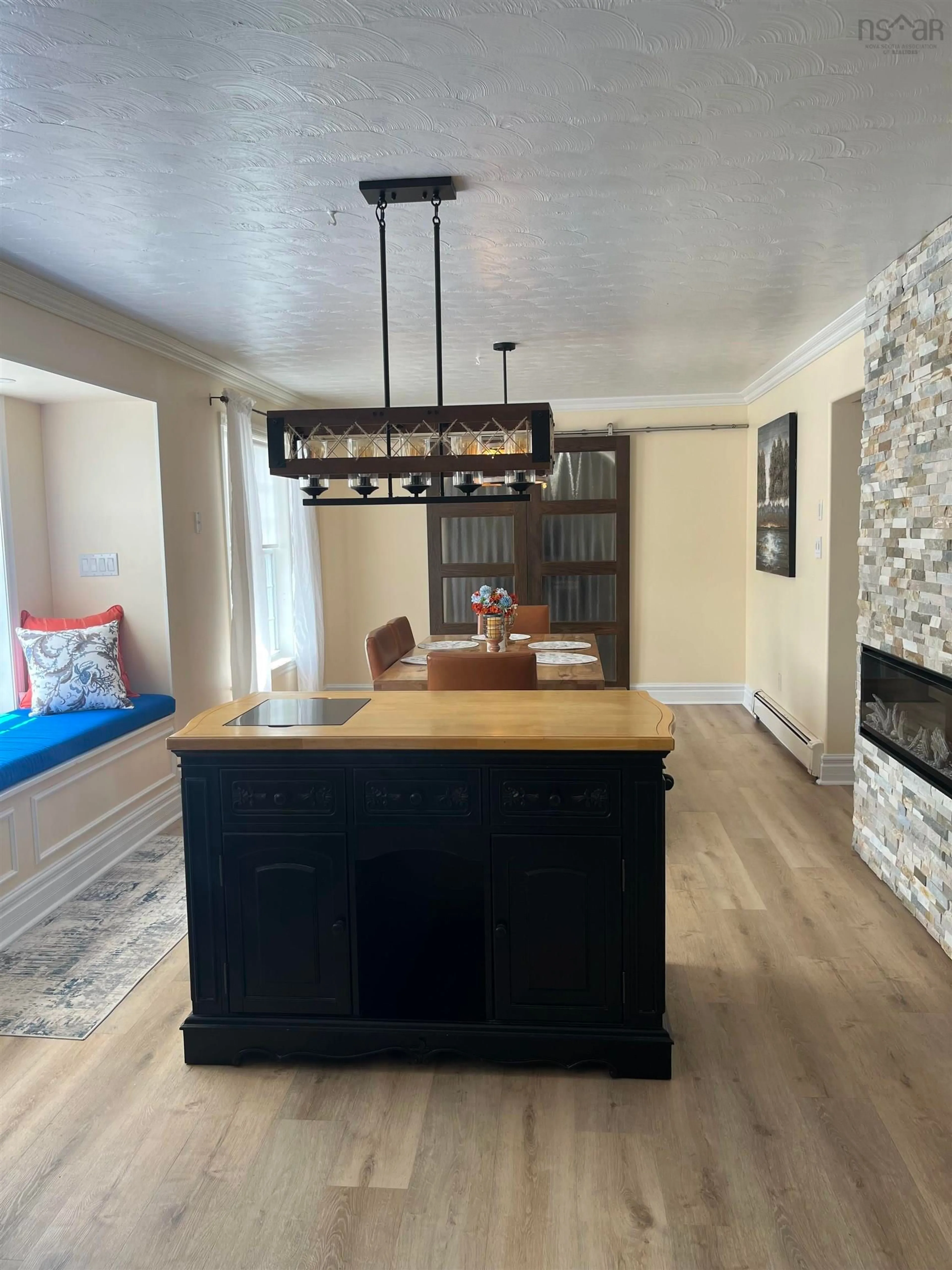Open concept kitchen, wood/laminate floor for 21 Woodward St, Glace Bay Nova Scotia B1A 4R4