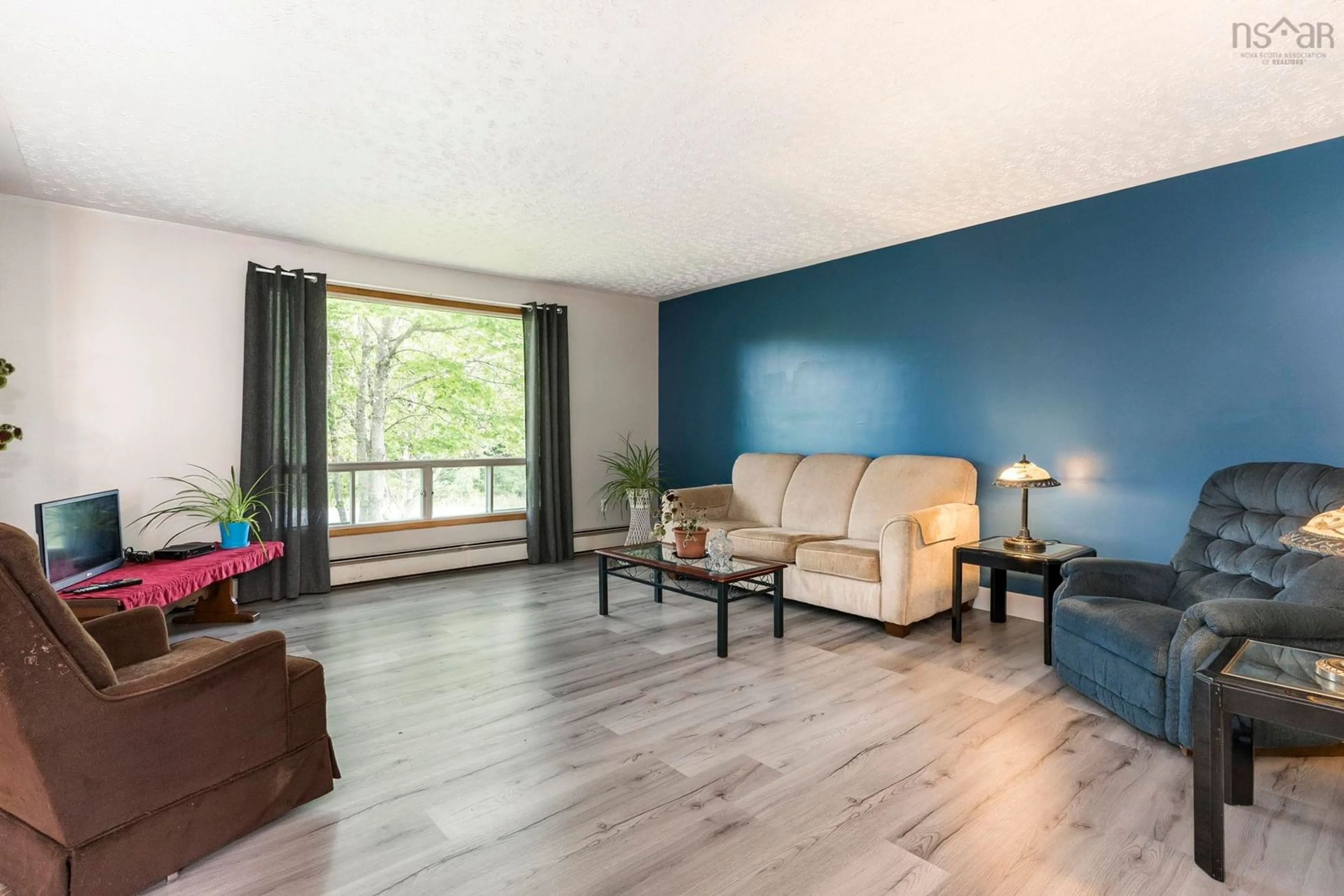 Living room with furniture, wood/laminate floor for 4 Melinda Ave, East Lawrencetown Nova Scotia B2Z 1N8