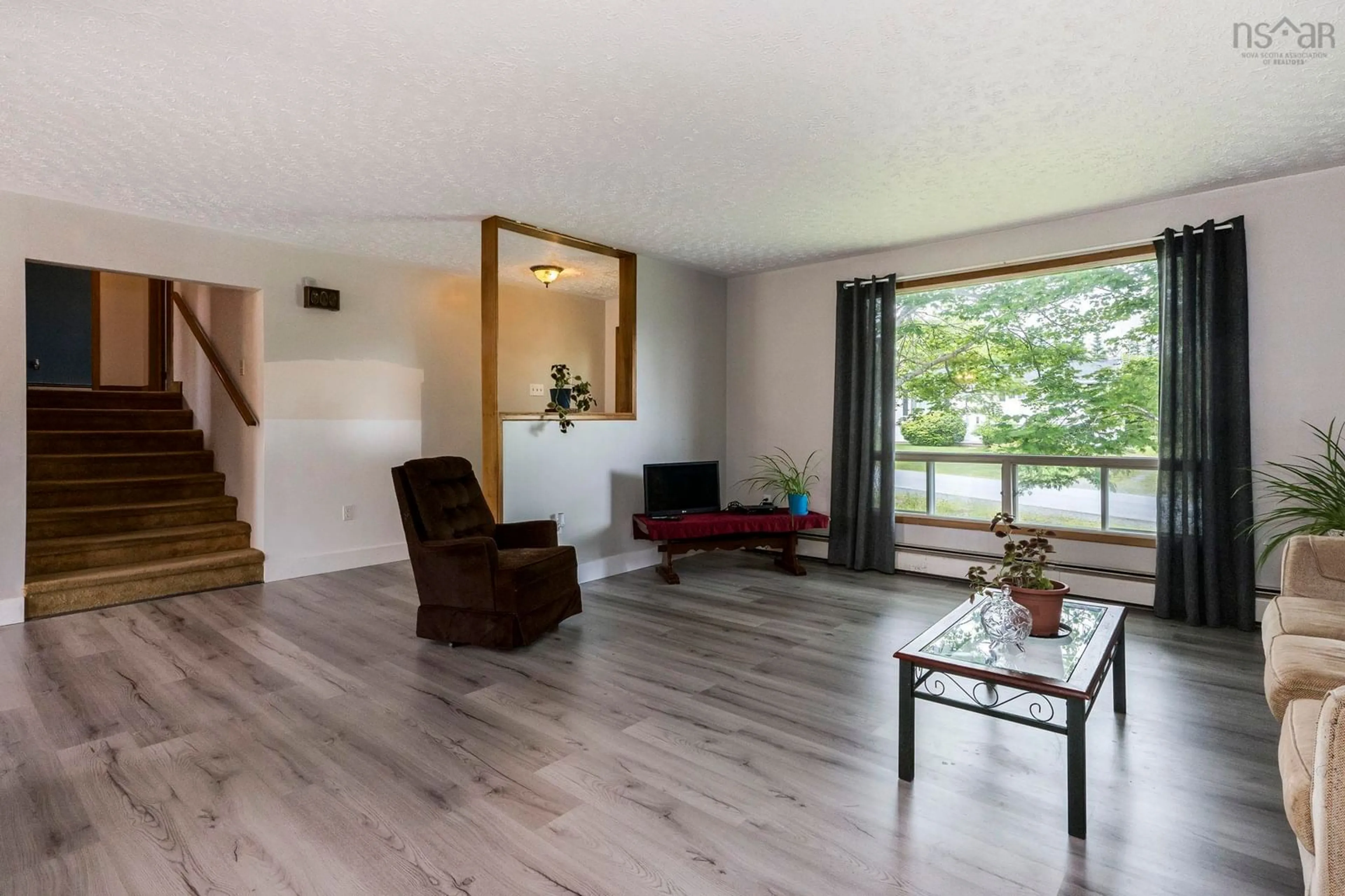Living room with furniture, wood/laminate floor for 4 Melinda Ave, East Lawrencetown Nova Scotia B2Z 1N8