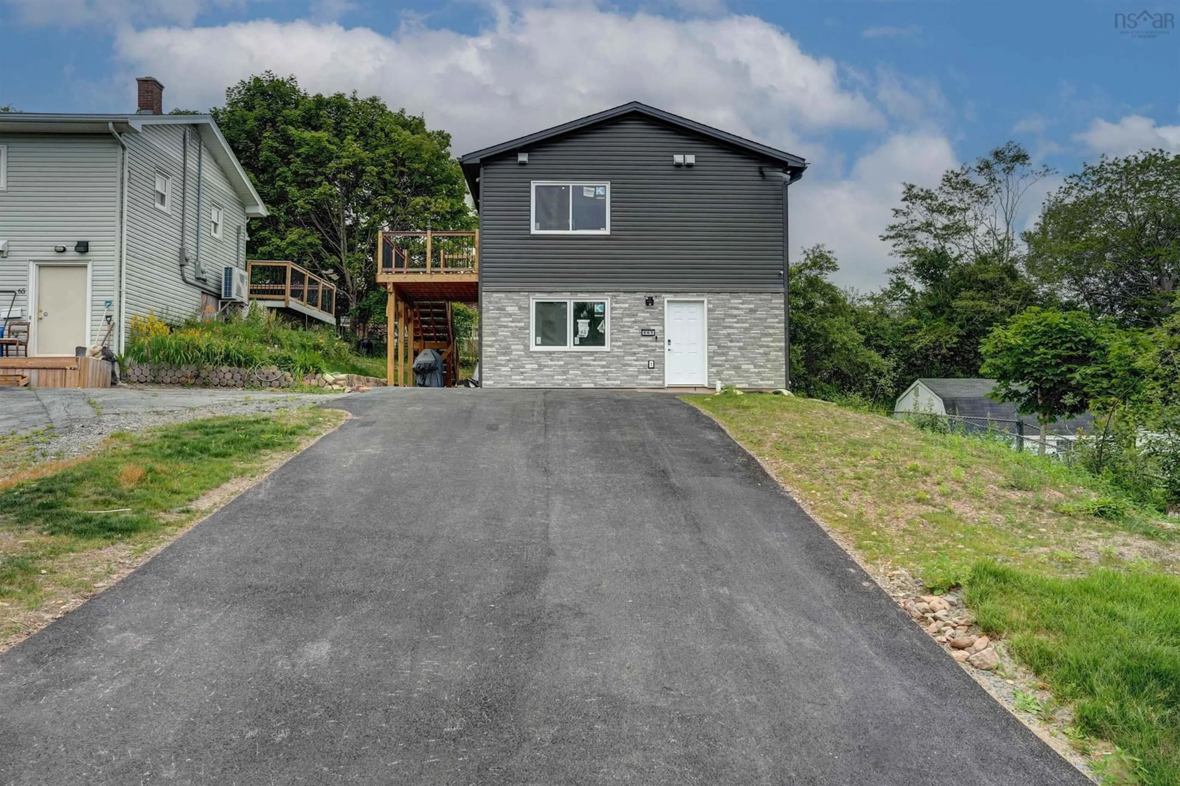 A pic from outside/outdoor area/front of a property/back of a property/a pic from drone, street for 61/63 Brian Dr, Dartmouth Nova Scotia B2W 2N2