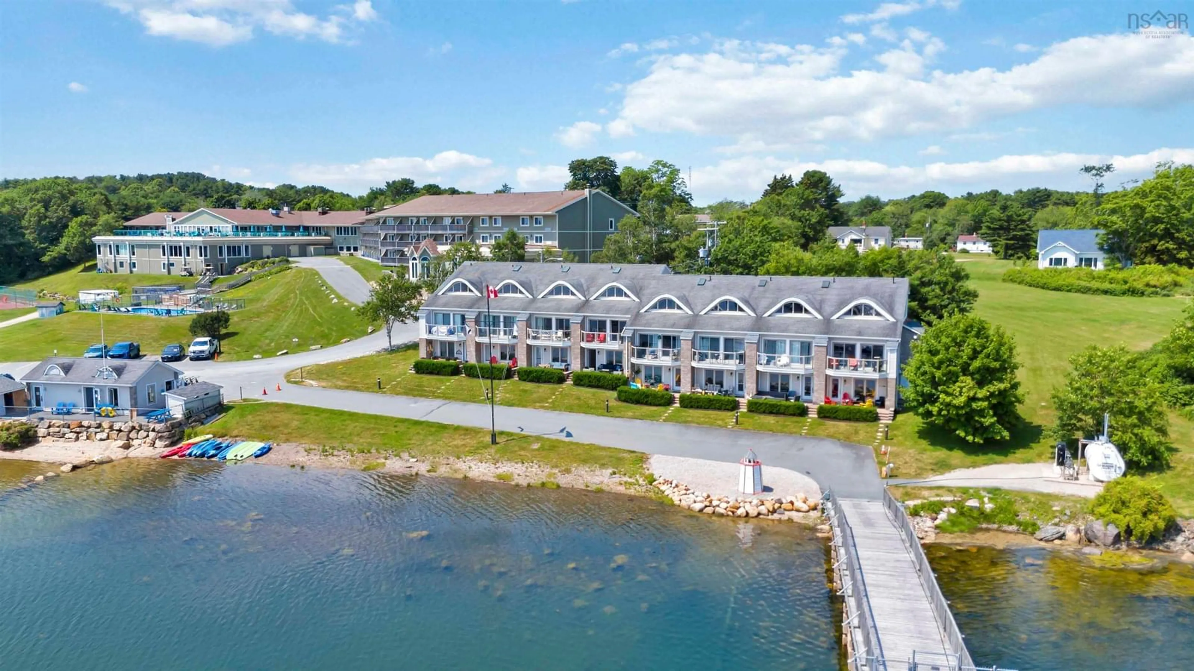 A pic from outside/outdoor area/front of a property/back of a property/a pic from drone, water/lake/river/ocean view for 9 Lavista Dr #Unit 4, Western Shore Nova Scotia B0J 3M0