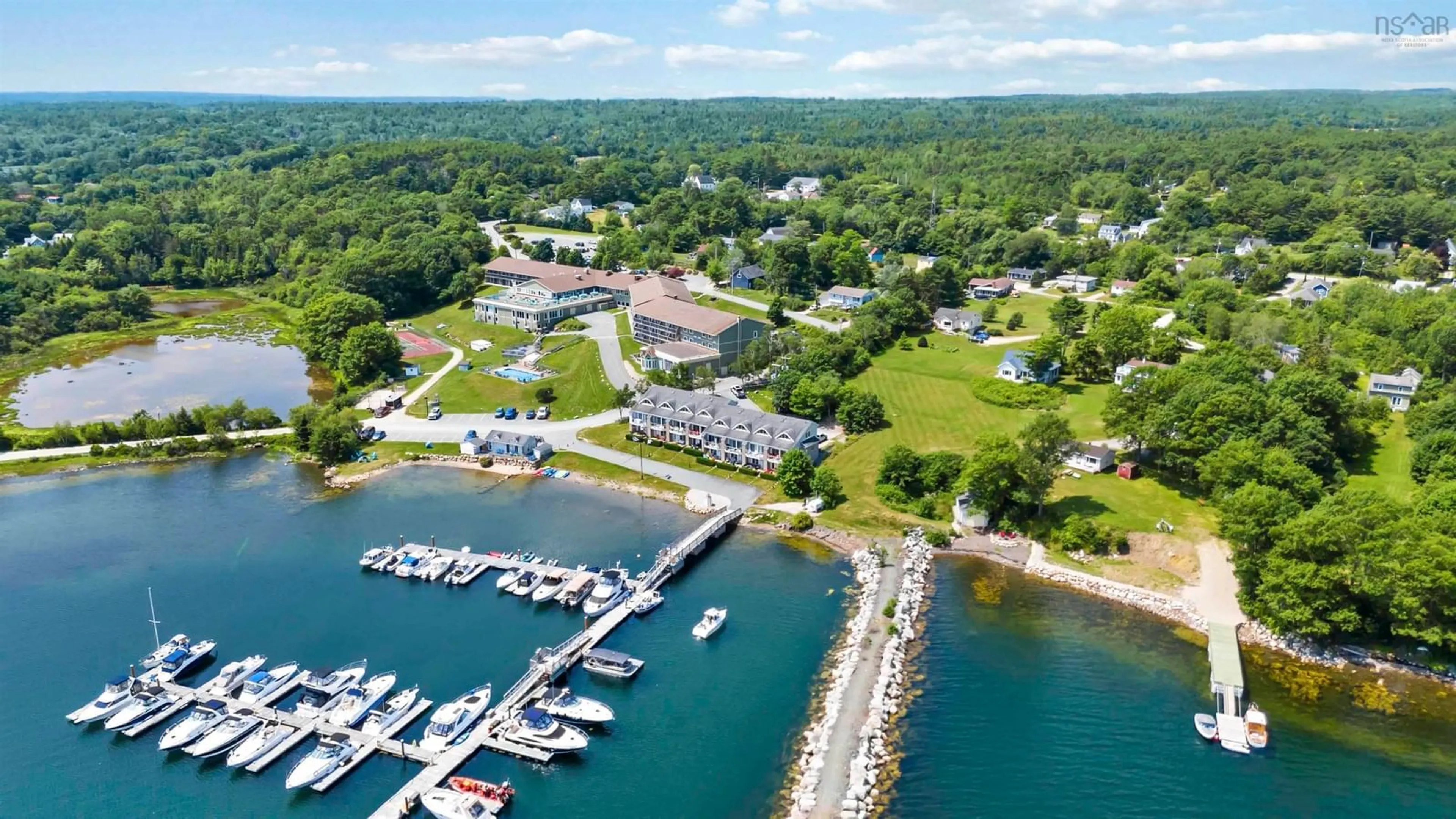 A pic from outside/outdoor area/front of a property/back of a property/a pic from drone, water/lake/river/ocean view for 9 Lavista Dr #Unit 4, Western Shore Nova Scotia B0J 3M0