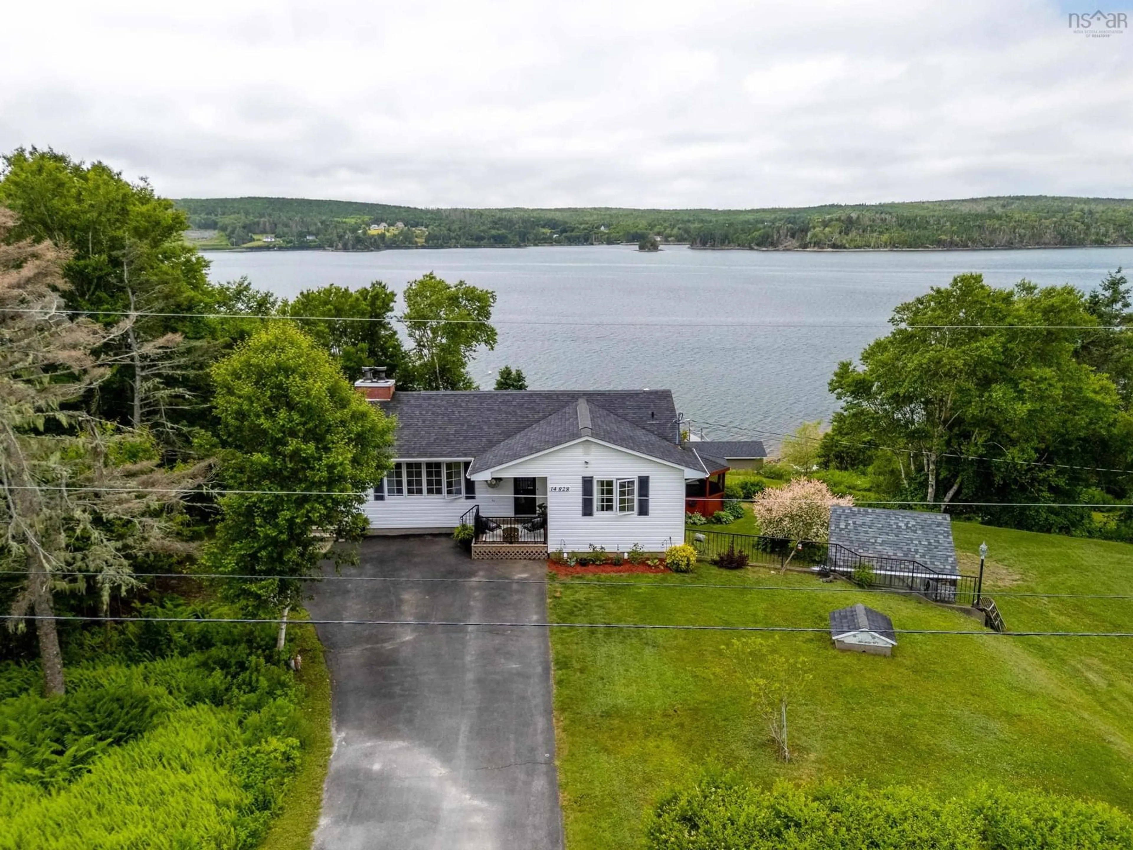 A pic from outside/outdoor area/front of a property/back of a property/a pic from drone, water/lake/river/ocean view for 14828 Highway 7, East Ship Harbour Nova Scotia B0J 3H0