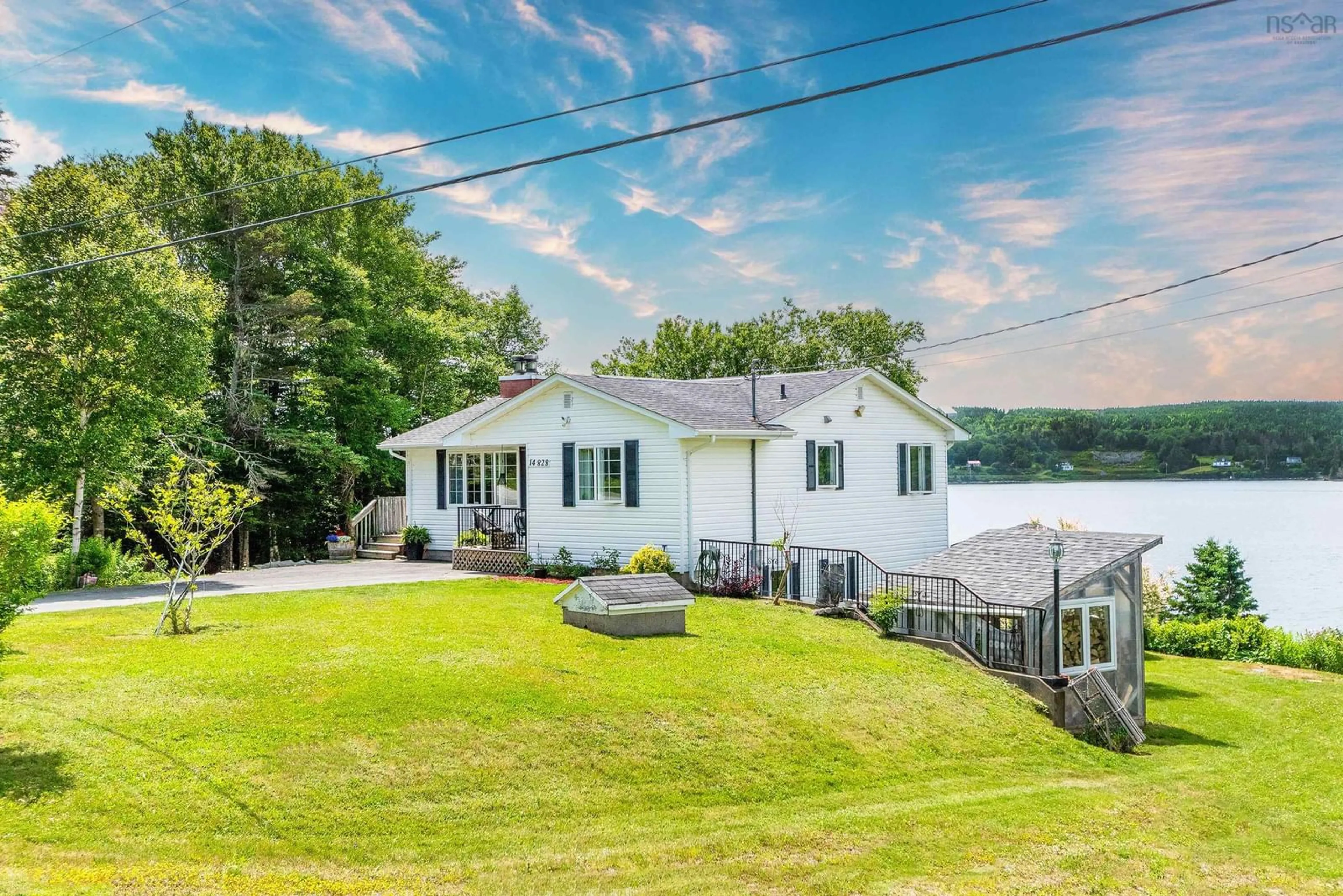 A pic from outside/outdoor area/front of a property/back of a property/a pic from drone, water/lake/river/ocean view for 14828 Highway 7, East Ship Harbour Nova Scotia B0J 3H0