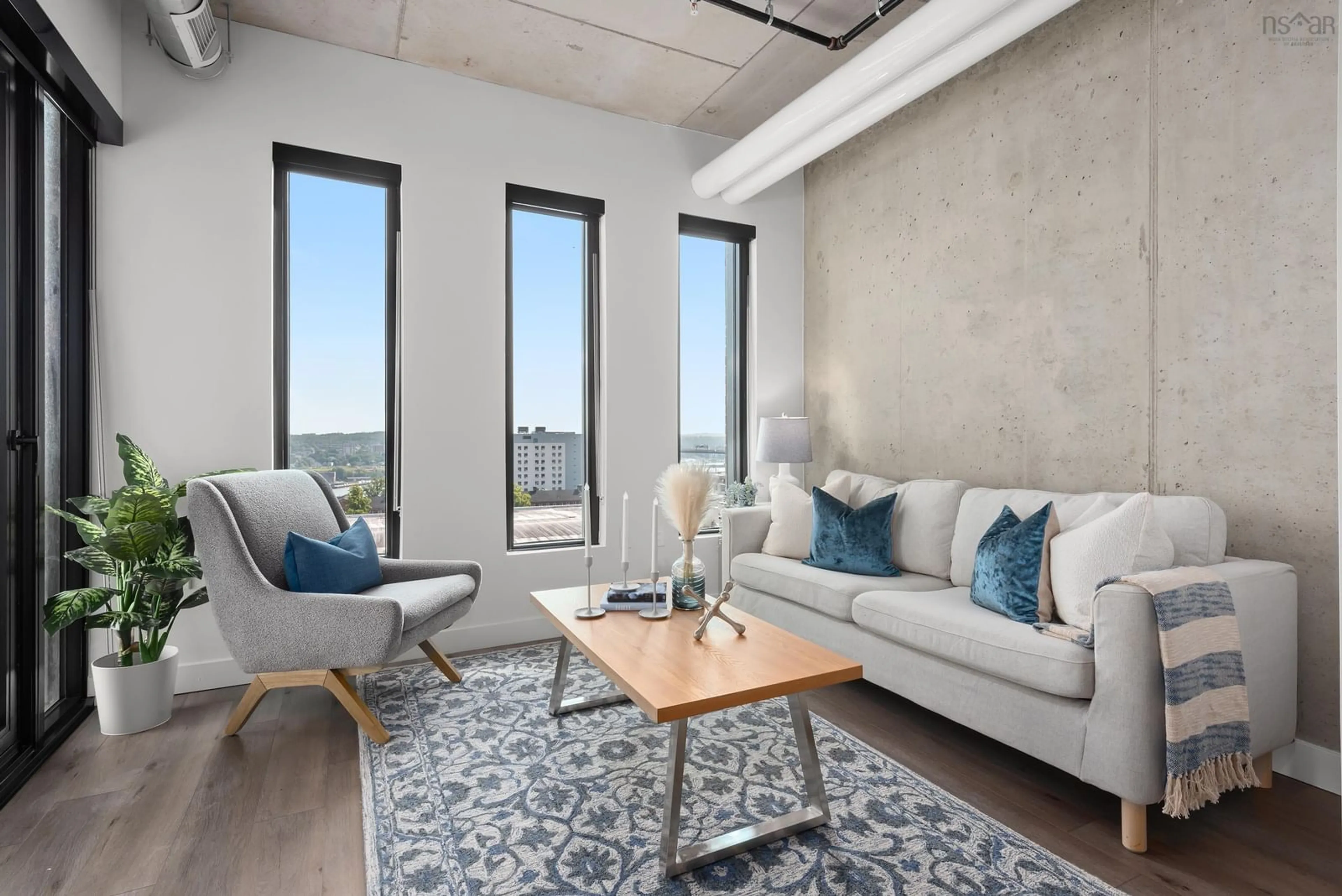 Living room with furniture, cement floor for 5511 Bilby St #711, Halifax Nova Scotia B3K 0M5