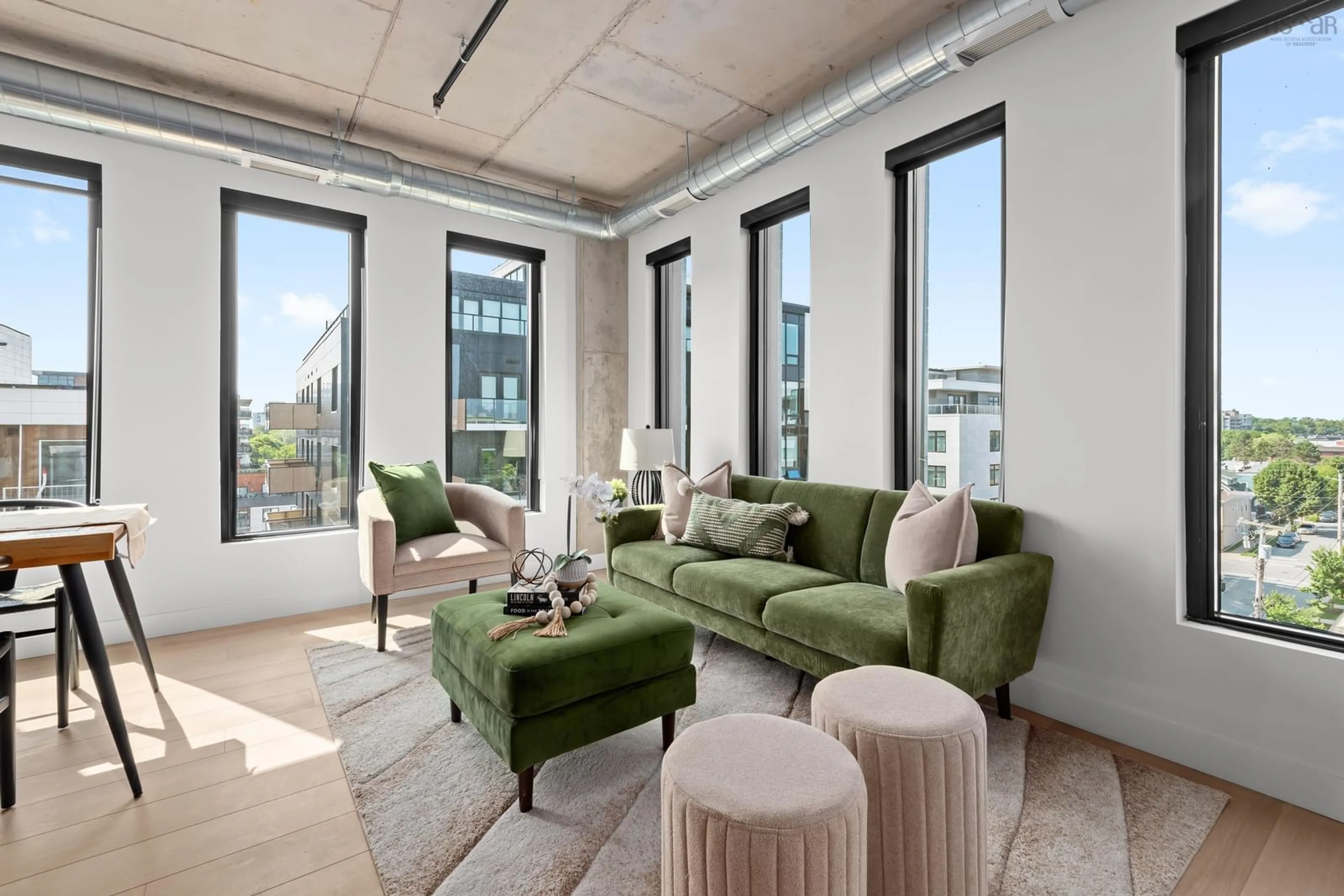 Living room with furniture, cement floor for 5511 Bilby St #704, Halifax Nova Scotia B3K 0M5