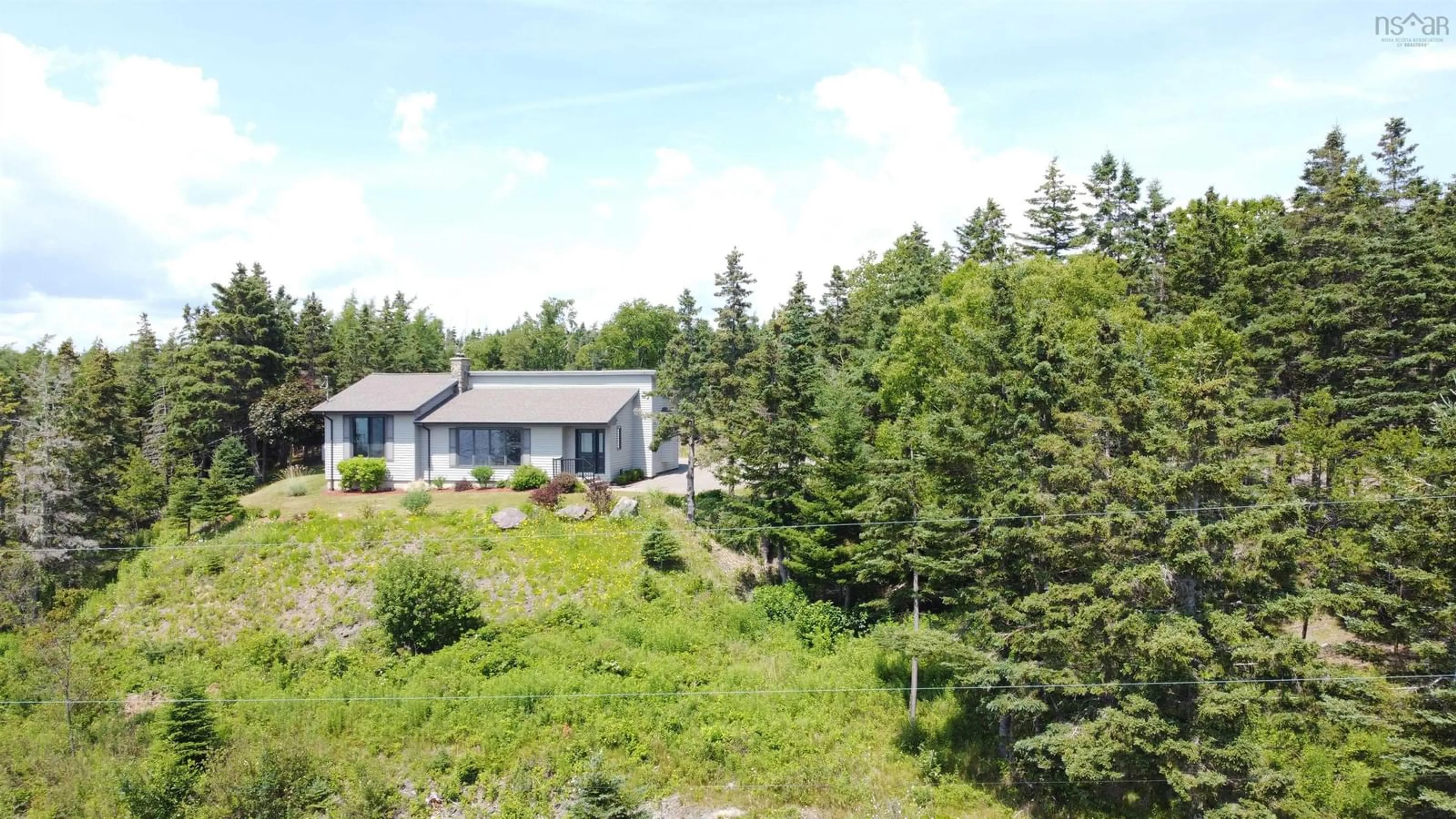 A pic from outside/outdoor area/front of a property/back of a property/a pic from drone, unknown for 351 Lochside Rd, D'Escousse Nova Scotia B0E 1K0