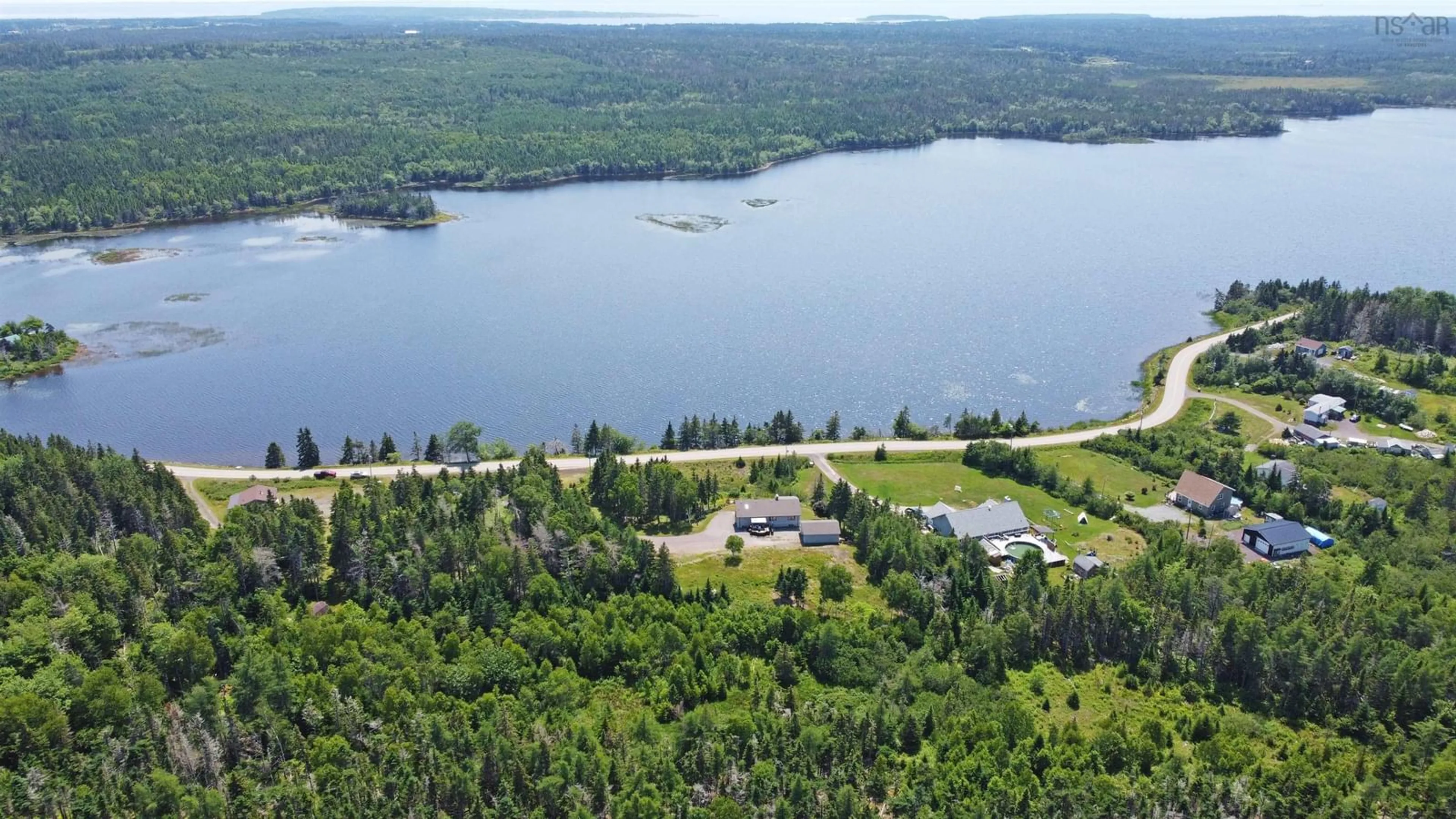 A pic from outside/outdoor area/front of a property/back of a property/a pic from drone, water/lake/river/ocean view for 351 Lochside Rd, D'Escousse Nova Scotia B0E 1K0
