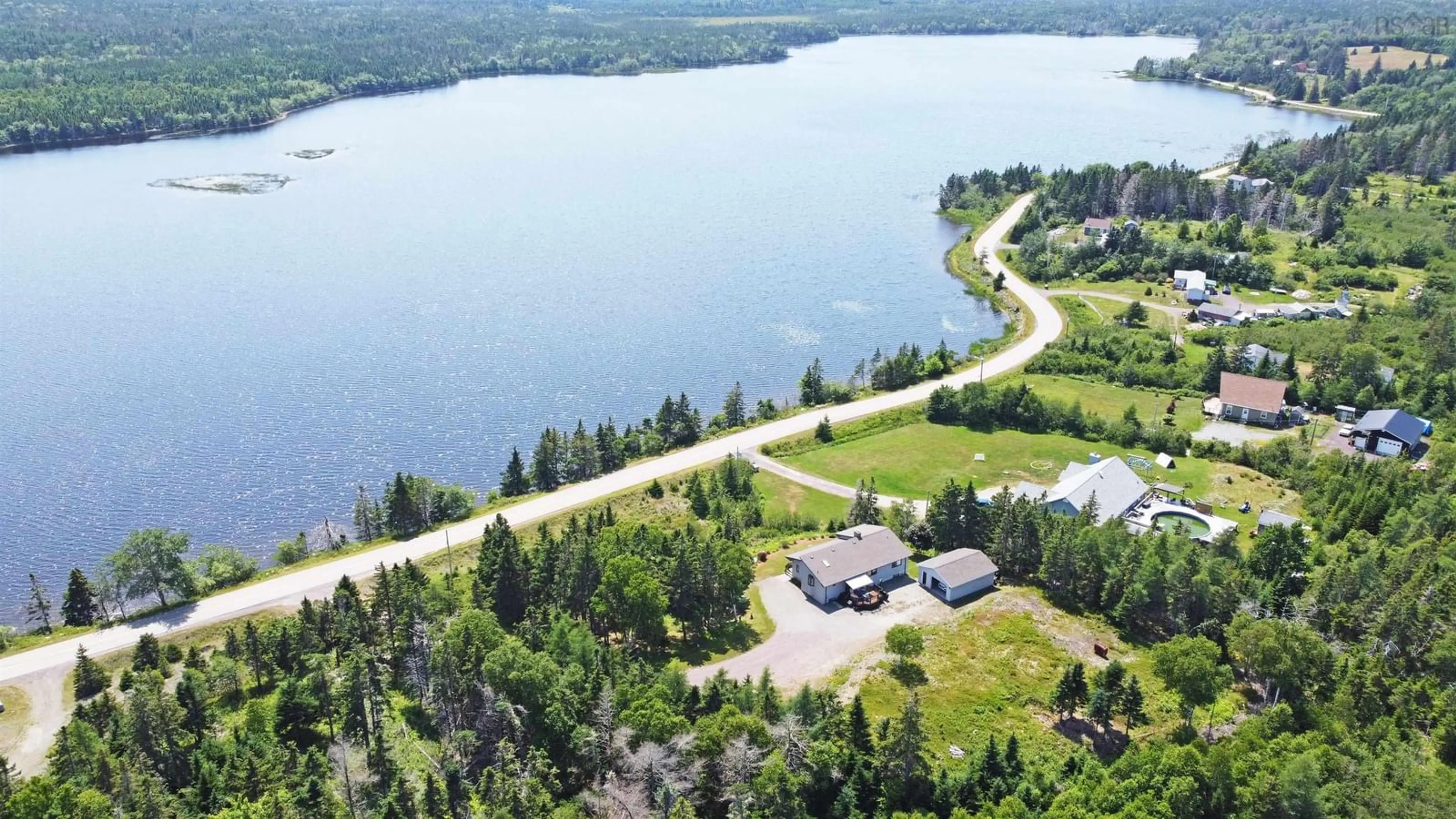 A pic from outside/outdoor area/front of a property/back of a property/a pic from drone, water/lake/river/ocean view for 351 Lochside Rd, D'Escousse Nova Scotia B0E 1K0
