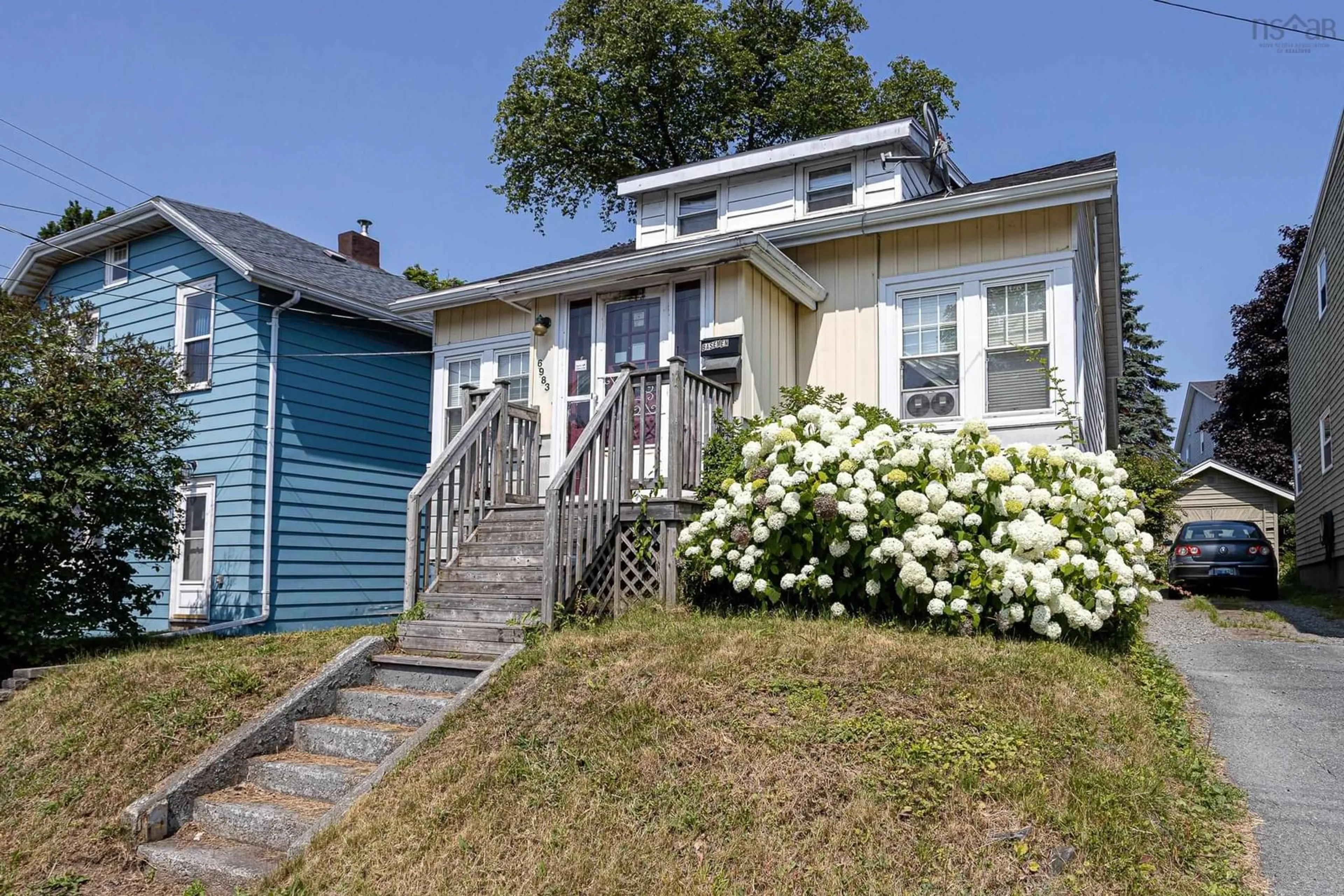 Home with vinyl exterior material, street for 6983 Chebucto Rd, Halifax Nova Scotia B3L 1M6