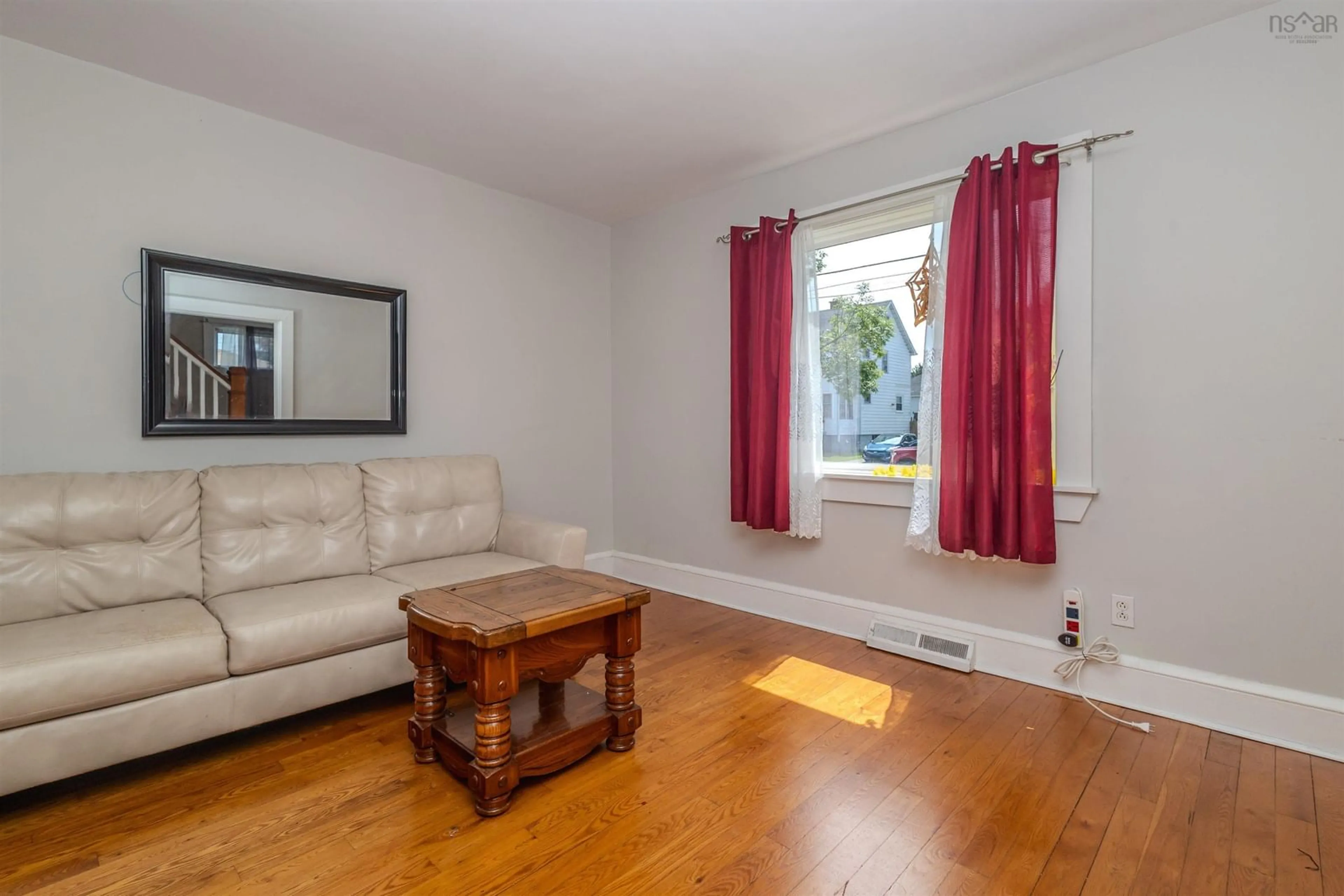 Living room with furniture, wood/laminate floor for 417 Chestnut Dr, Sydney Nova Scotia B1P 4Z1