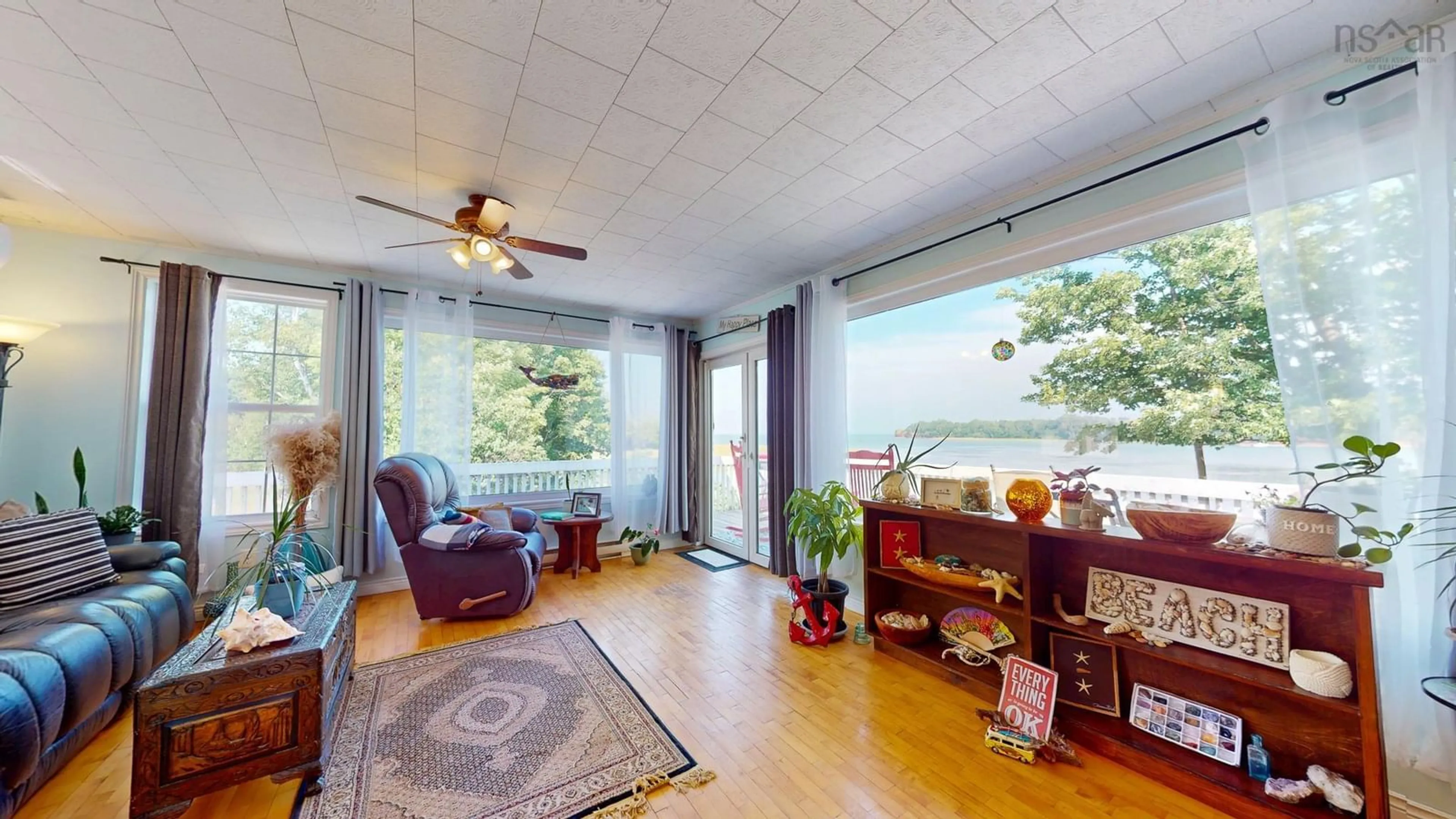 Living room with furniture, wood/laminate floor for 1258 Pereau Rd, Upper Pereau Nova Scotia B0P 1H0