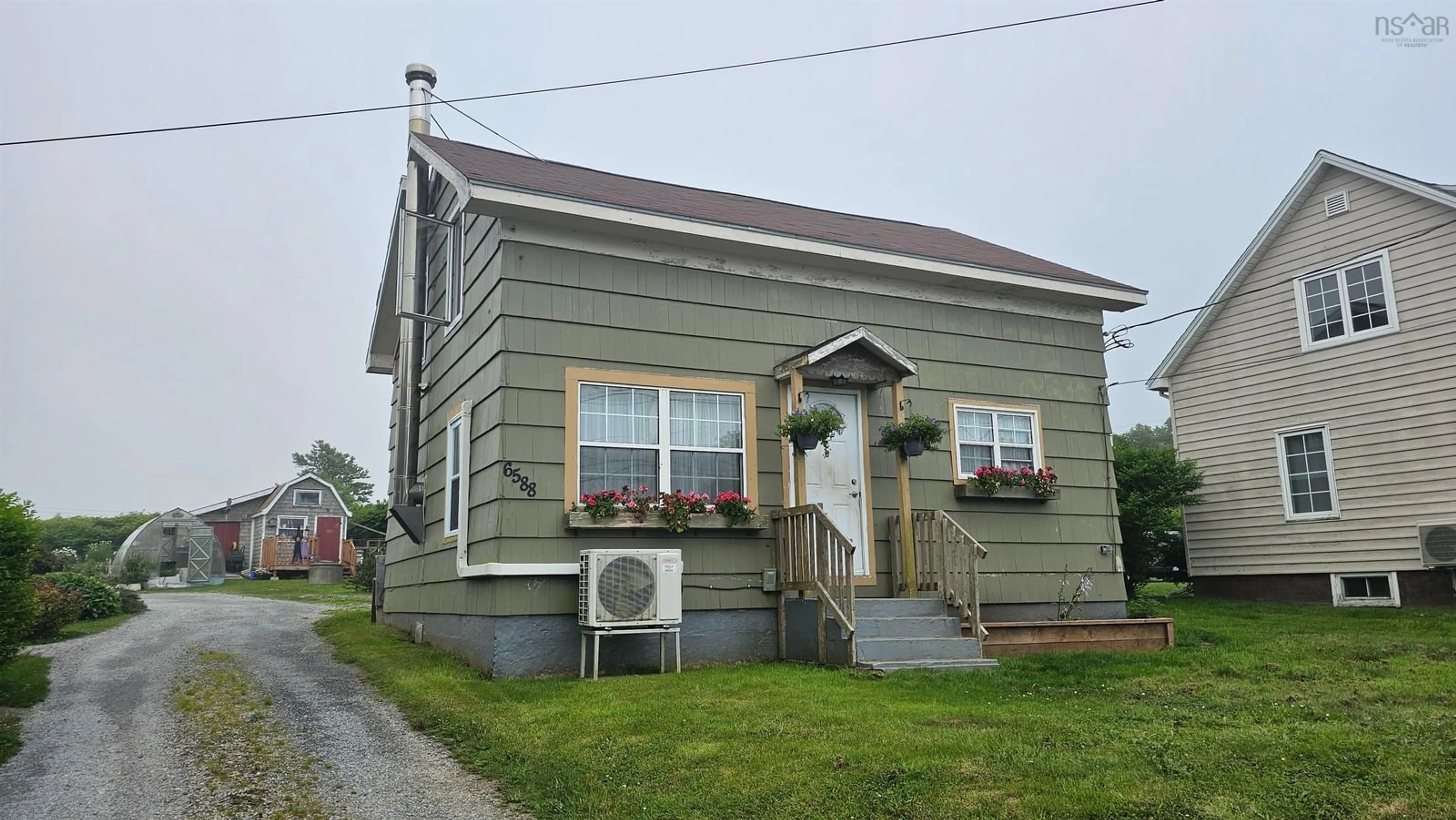 Home with vinyl exterior material, street for 6588 Highway 3, Lower Woods Harbour Nova Scotia B0W 2E0