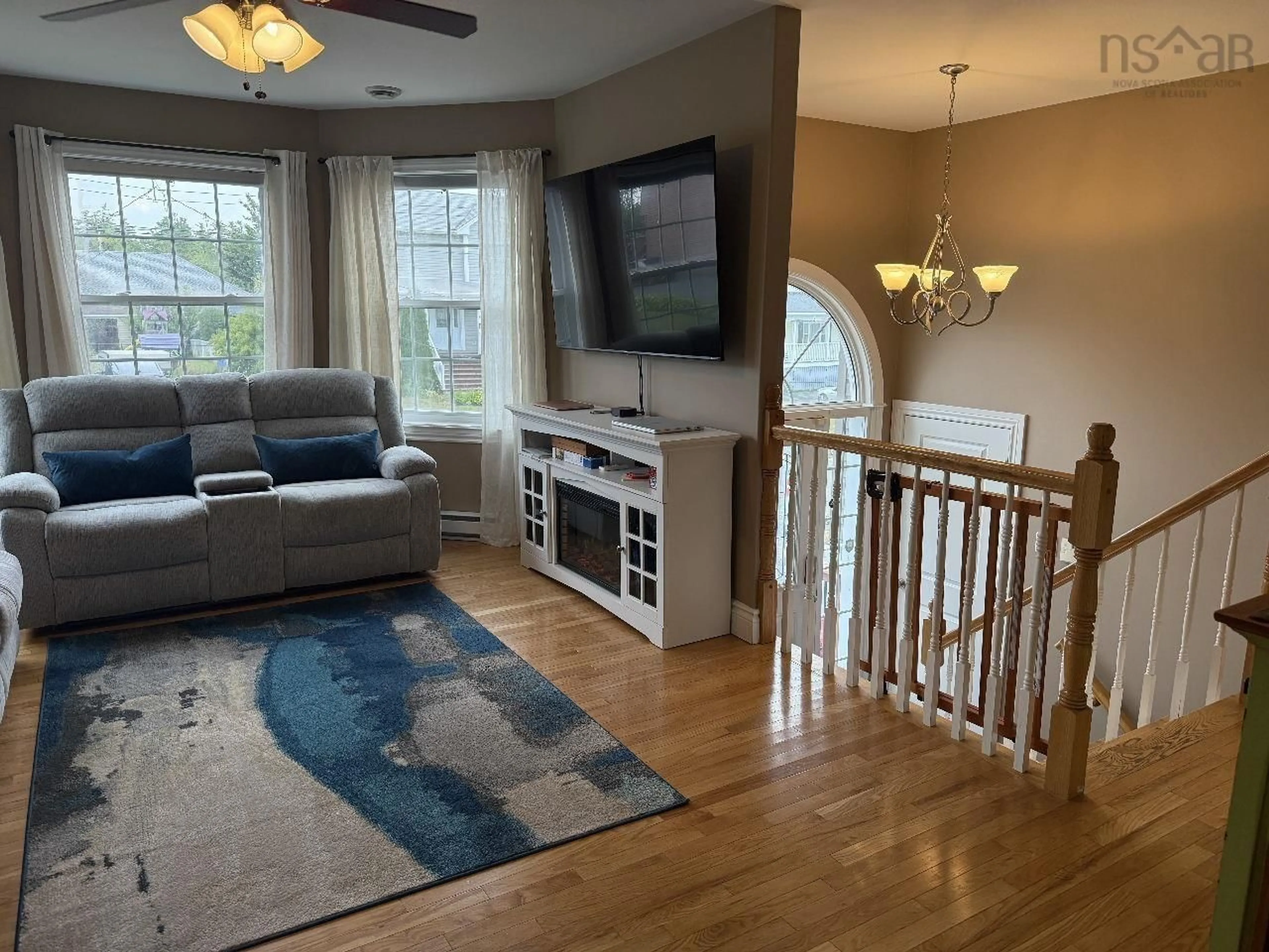 Living room with furniture, wood/laminate floor for 5 Lillian Crt, Elmsdale Nova Scotia B2S 0A2