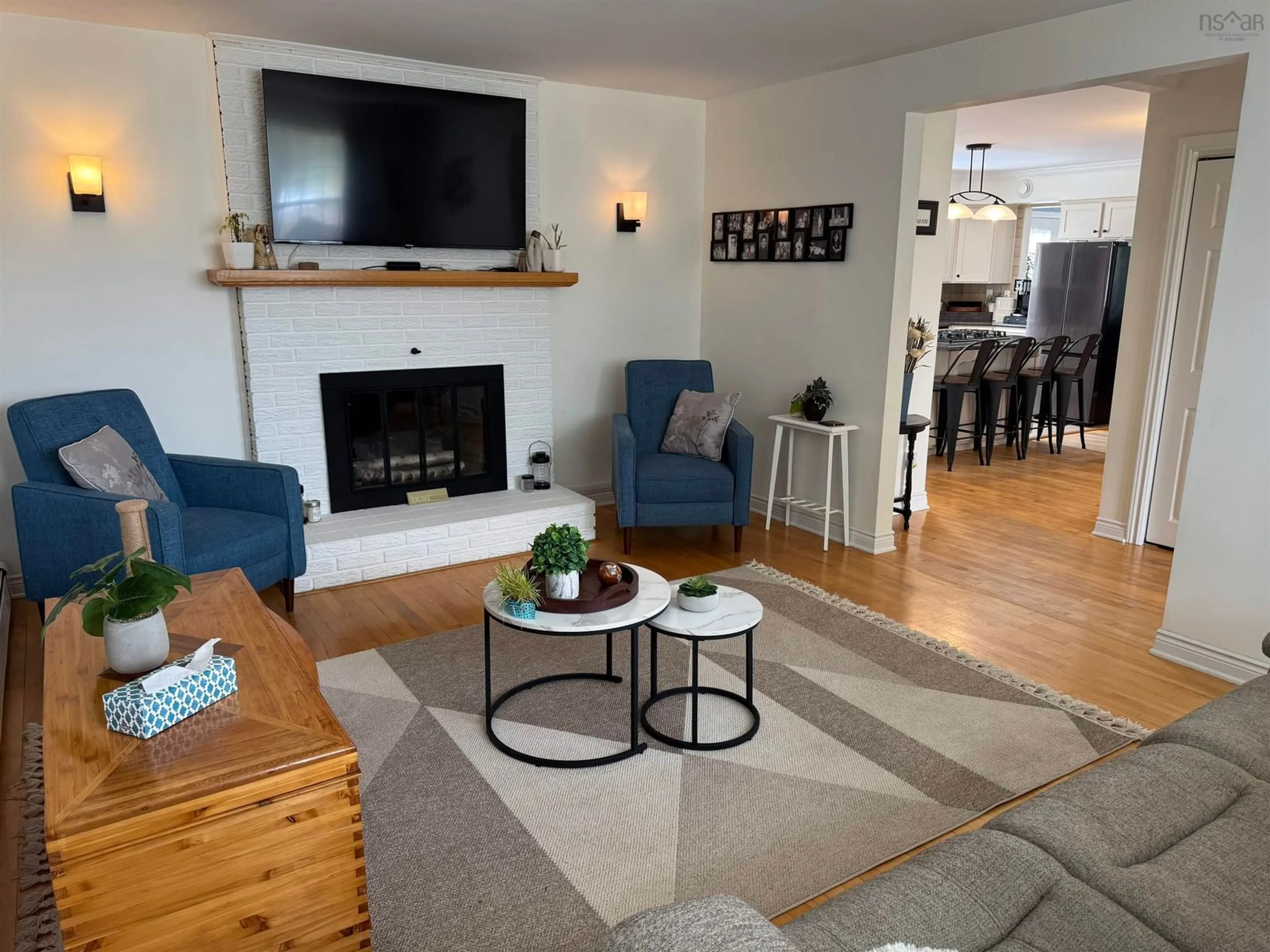 Living room with furniture, wood/laminate floor for 95 Poplar St, Stellarton Nova Scotia B0K 1S0