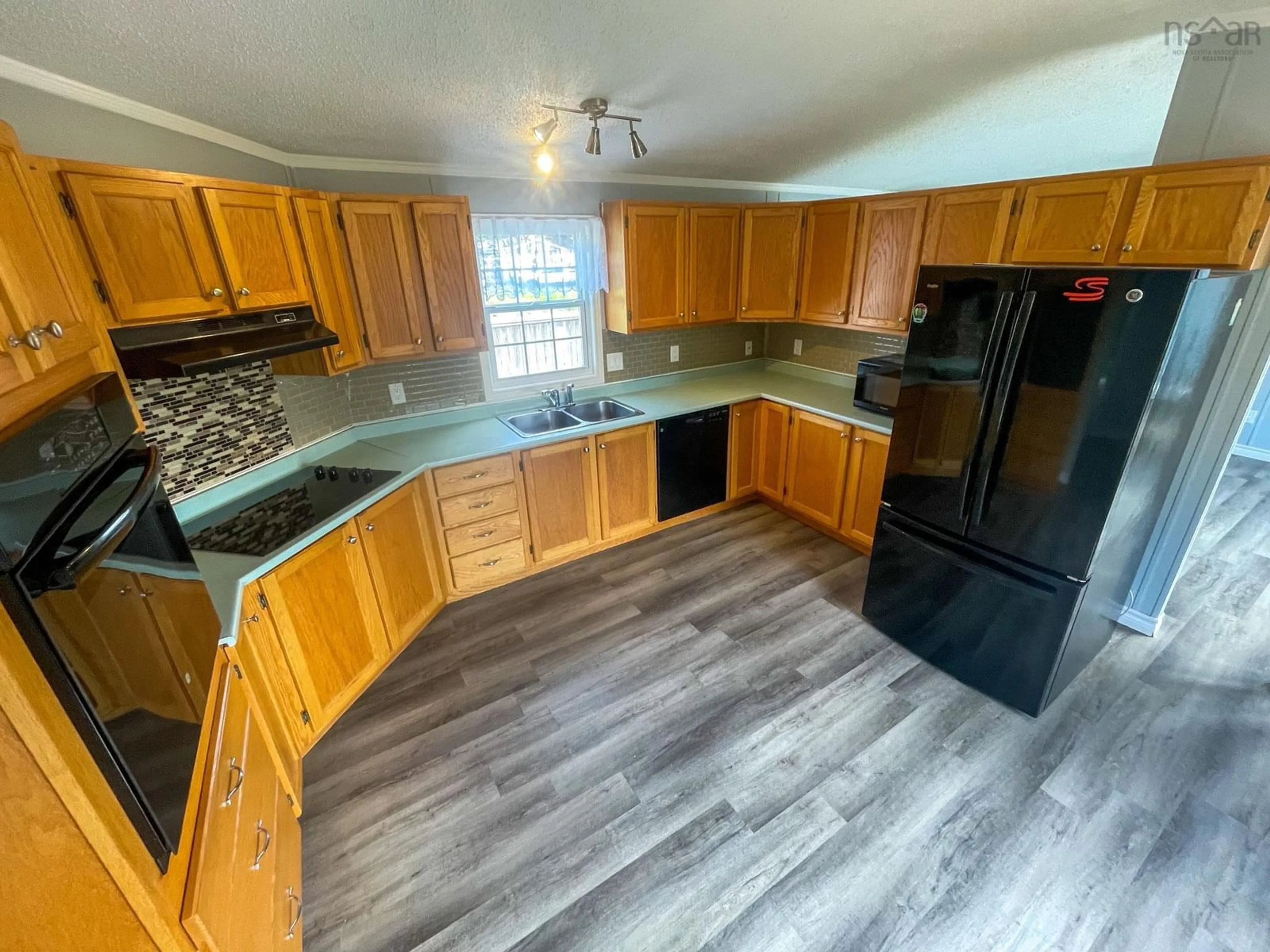 Open concept kitchen, unknown for 39 Kent St, Louisbourg Nova Scotia B1C 1G2