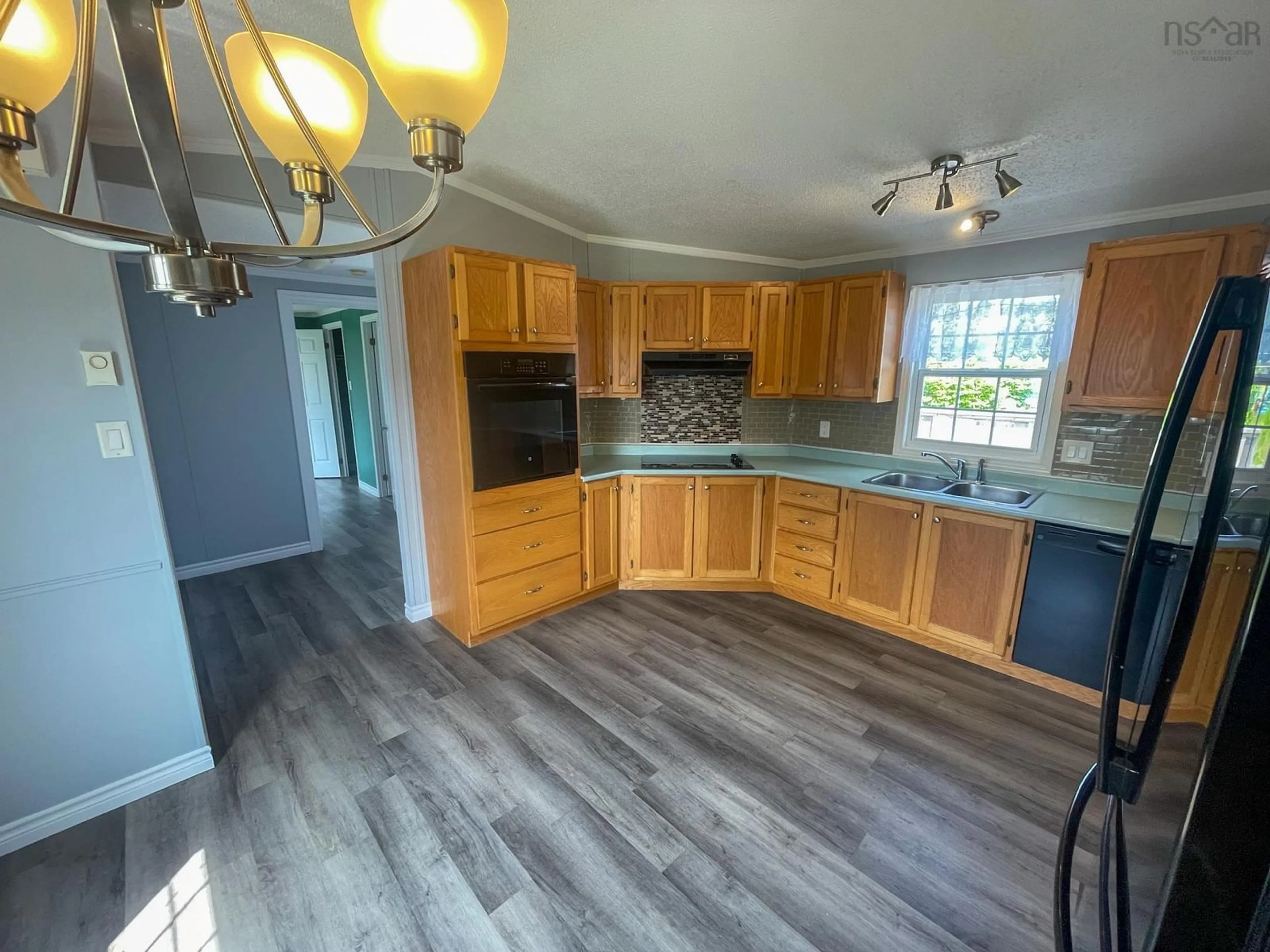 Open concept kitchen, unknown for 39 Kent St, Louisbourg Nova Scotia B1C 1G2