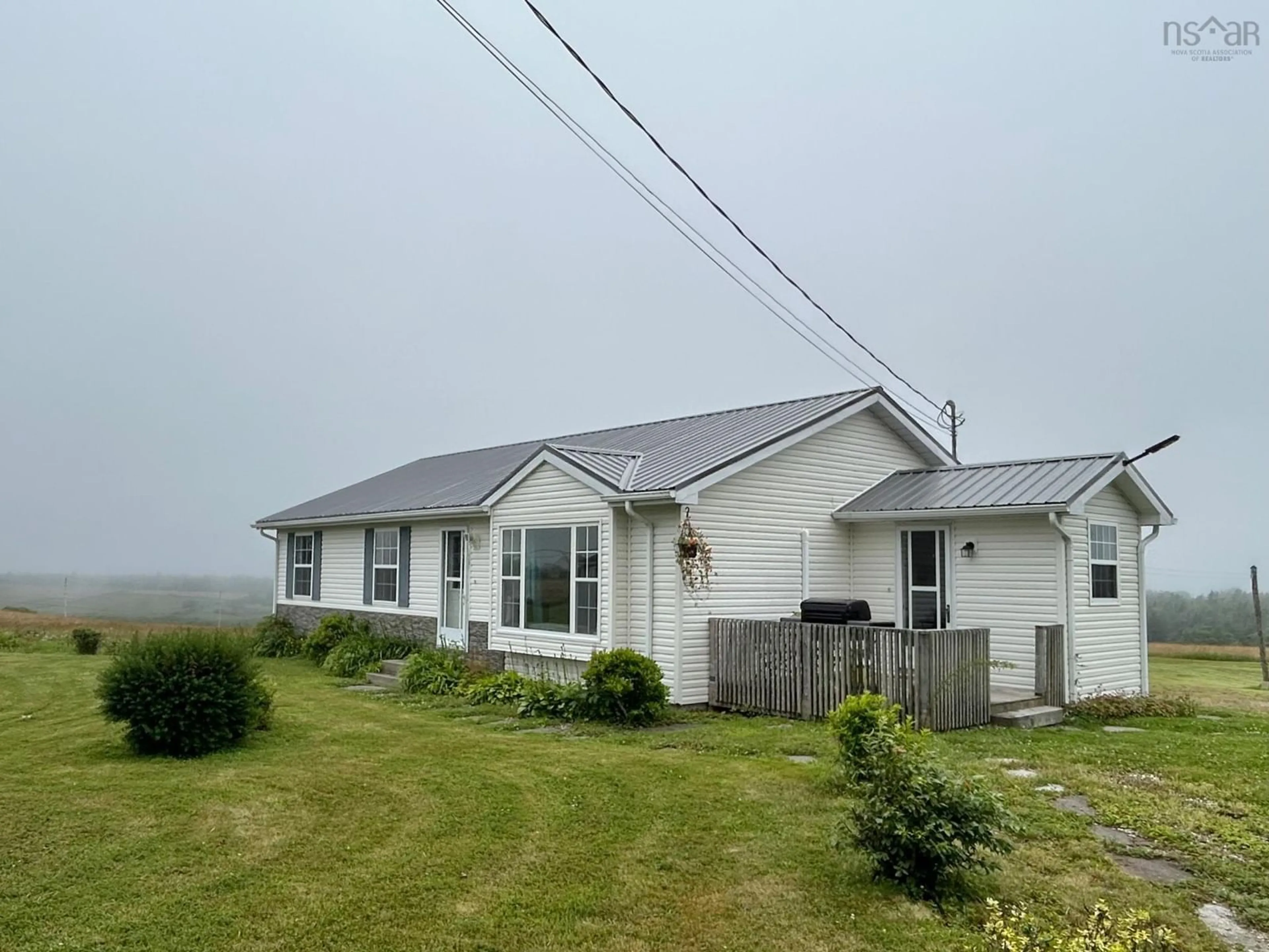 A pic from outside/outdoor area/front of a property/back of a property/a pic from drone, unknown for 845 Main Shore Rd, North Chegoggin Nova Scotia B5A 5H2