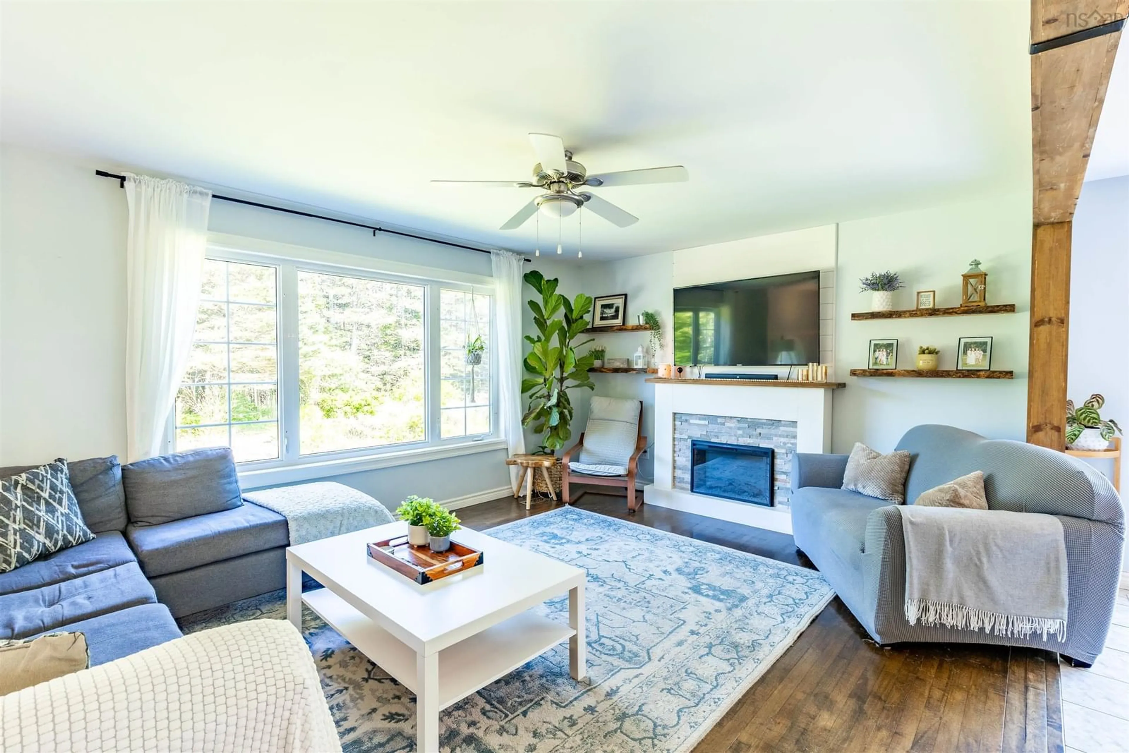 Living room with furniture, wood/laminate floor for 231 Highway 308, Morris Island Nova Scotia B0W 3M0