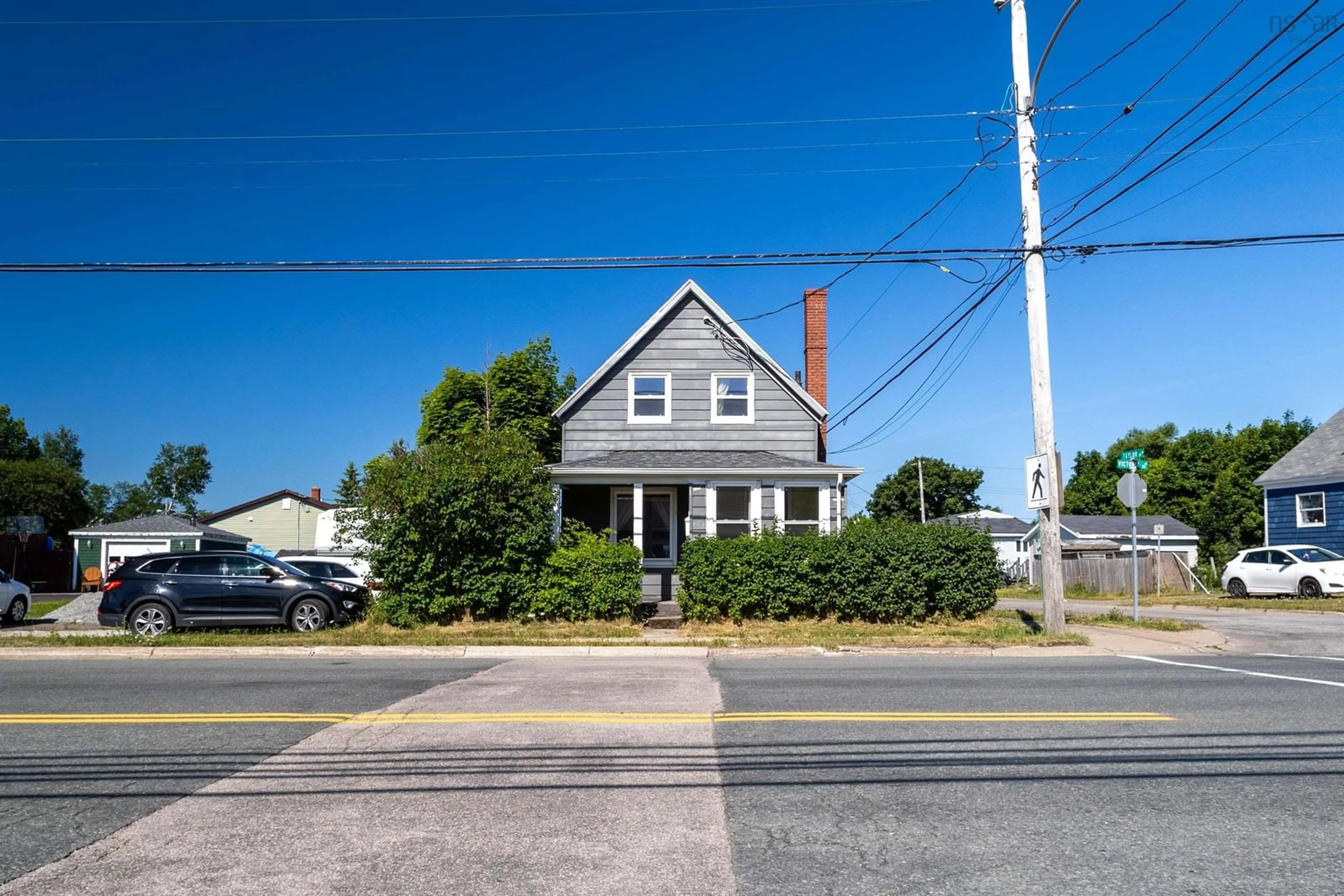 A pic from outside/outdoor area/front of a property/back of a property/a pic from drone, street for 1373 Victoria Rd, Sydney Nova Scotia B1N 2W9