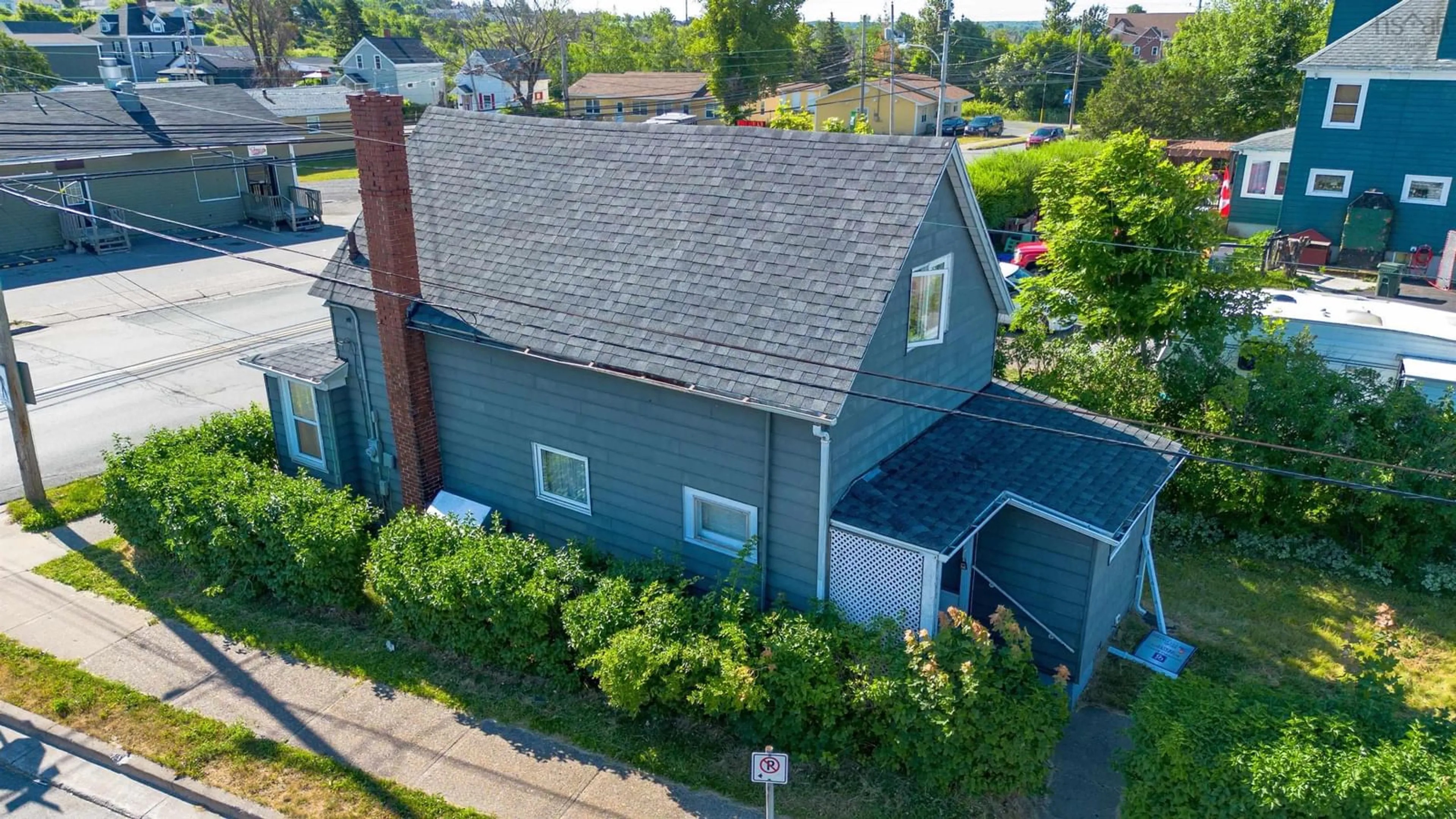 A pic from outside/outdoor area/front of a property/back of a property/a pic from drone, street for 1373 Victoria Rd, Sydney Nova Scotia B1N 2W9