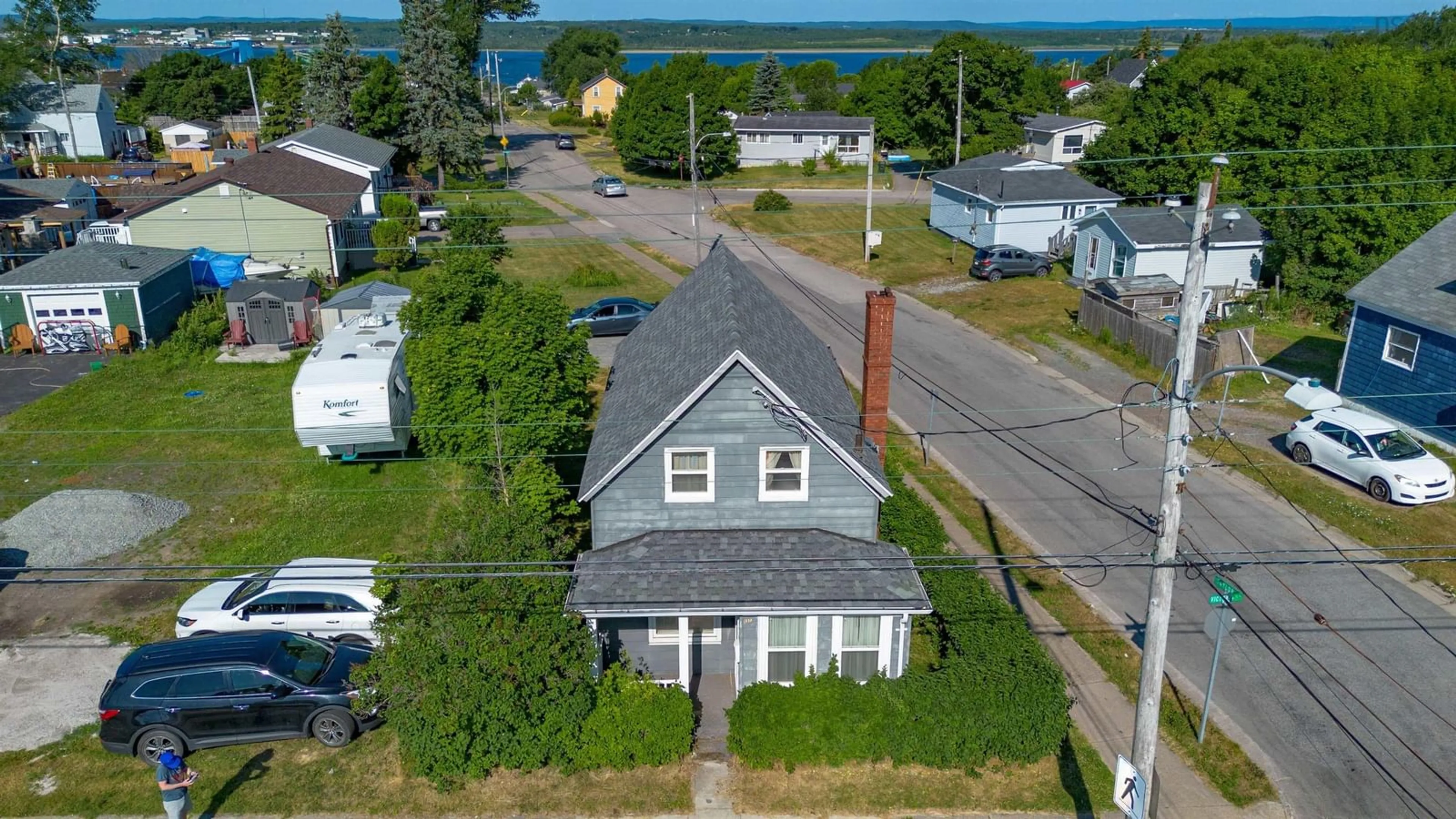 A pic from outside/outdoor area/front of a property/back of a property/a pic from drone, street for 1373 Victoria Rd, Sydney Nova Scotia B1N 2W9
