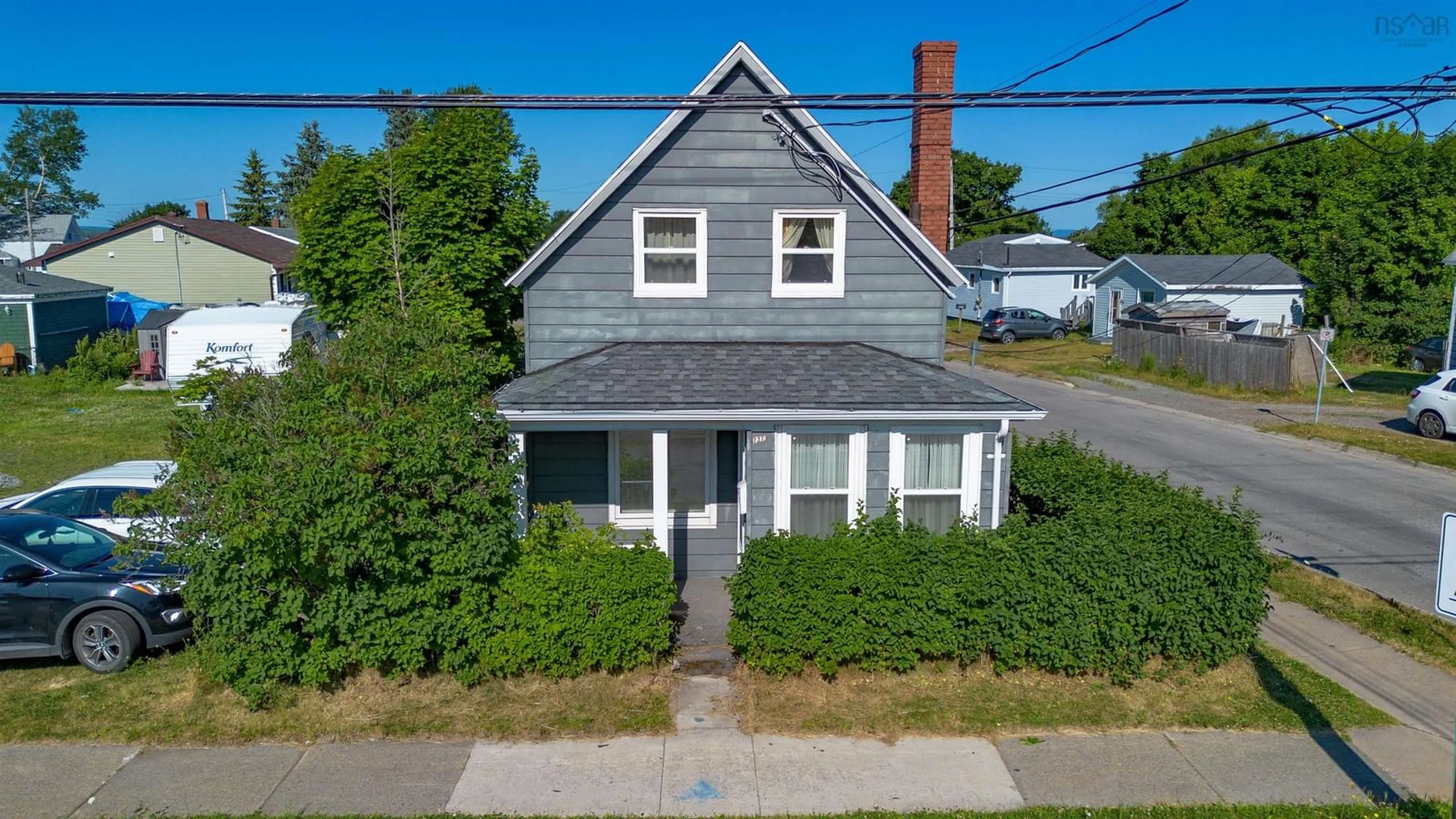 A pic from outside/outdoor area/front of a property/back of a property/a pic from drone, street for 1373 Victoria Rd, Sydney Nova Scotia B1N 2W9