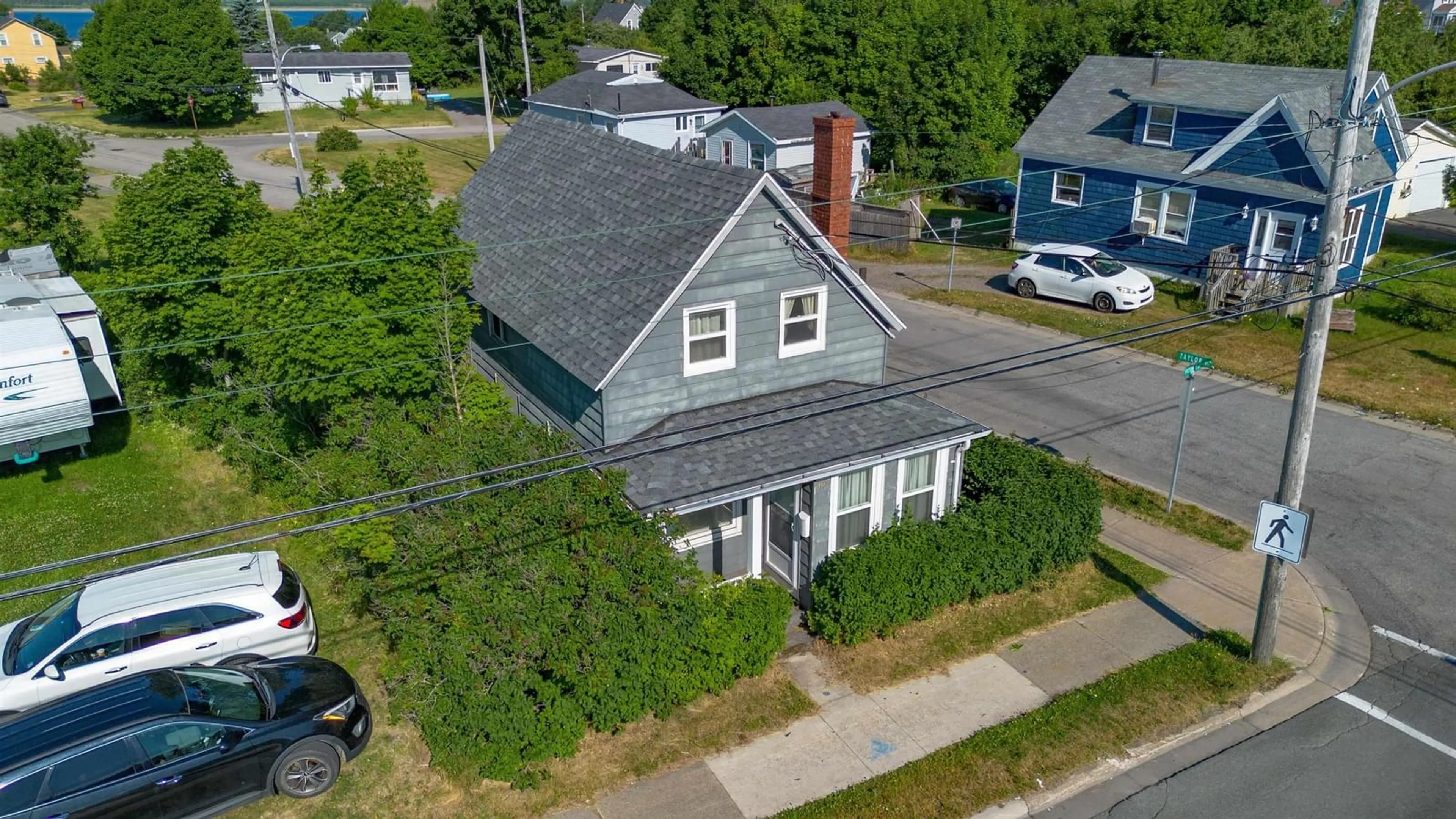 A pic from outside/outdoor area/front of a property/back of a property/a pic from drone, street for 1373 Victoria Rd, Sydney Nova Scotia B1N 2W9