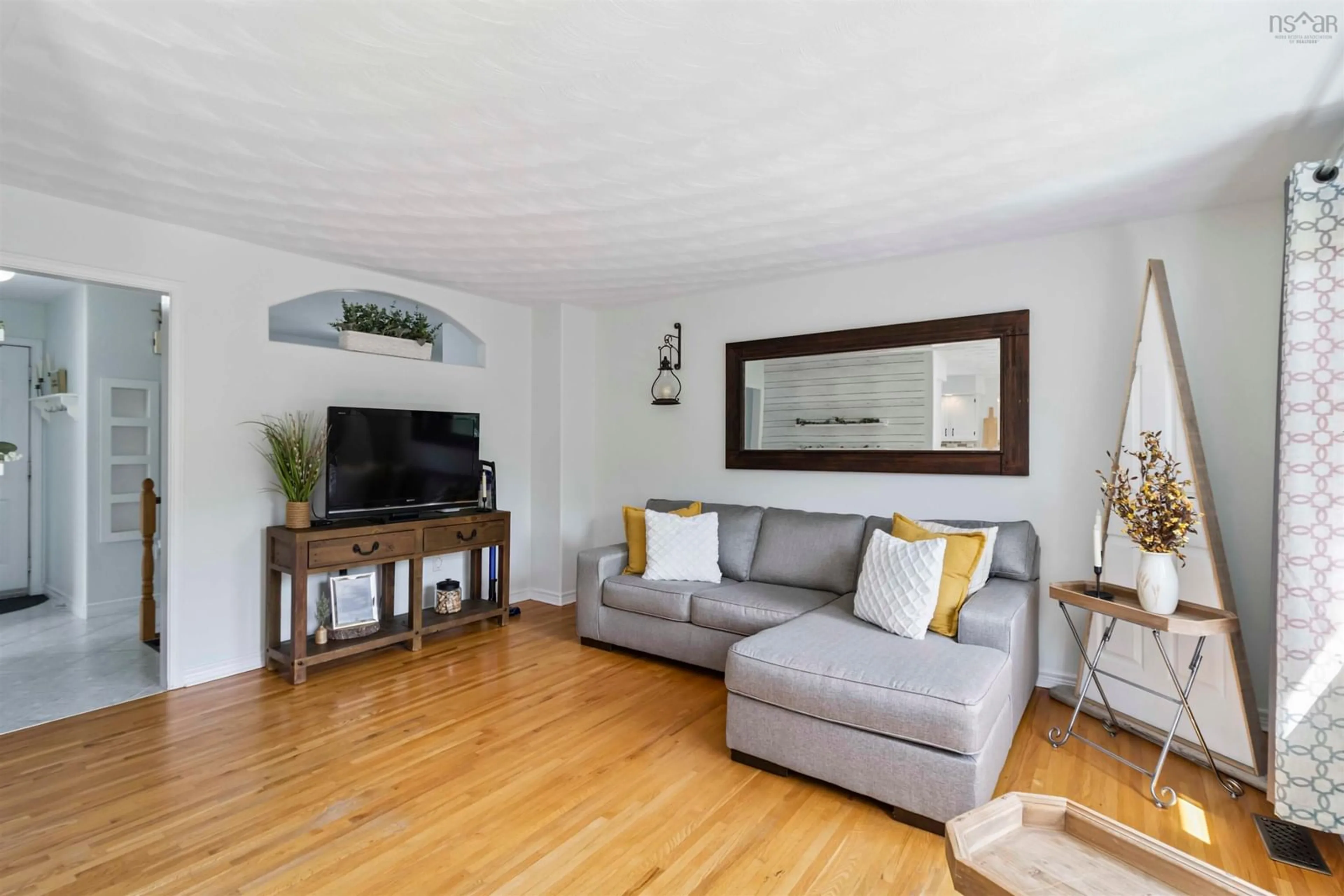 Living room with furniture, wood/laminate floor for 445 Astral Dr, Colby South Nova Scotia B2V 2V1