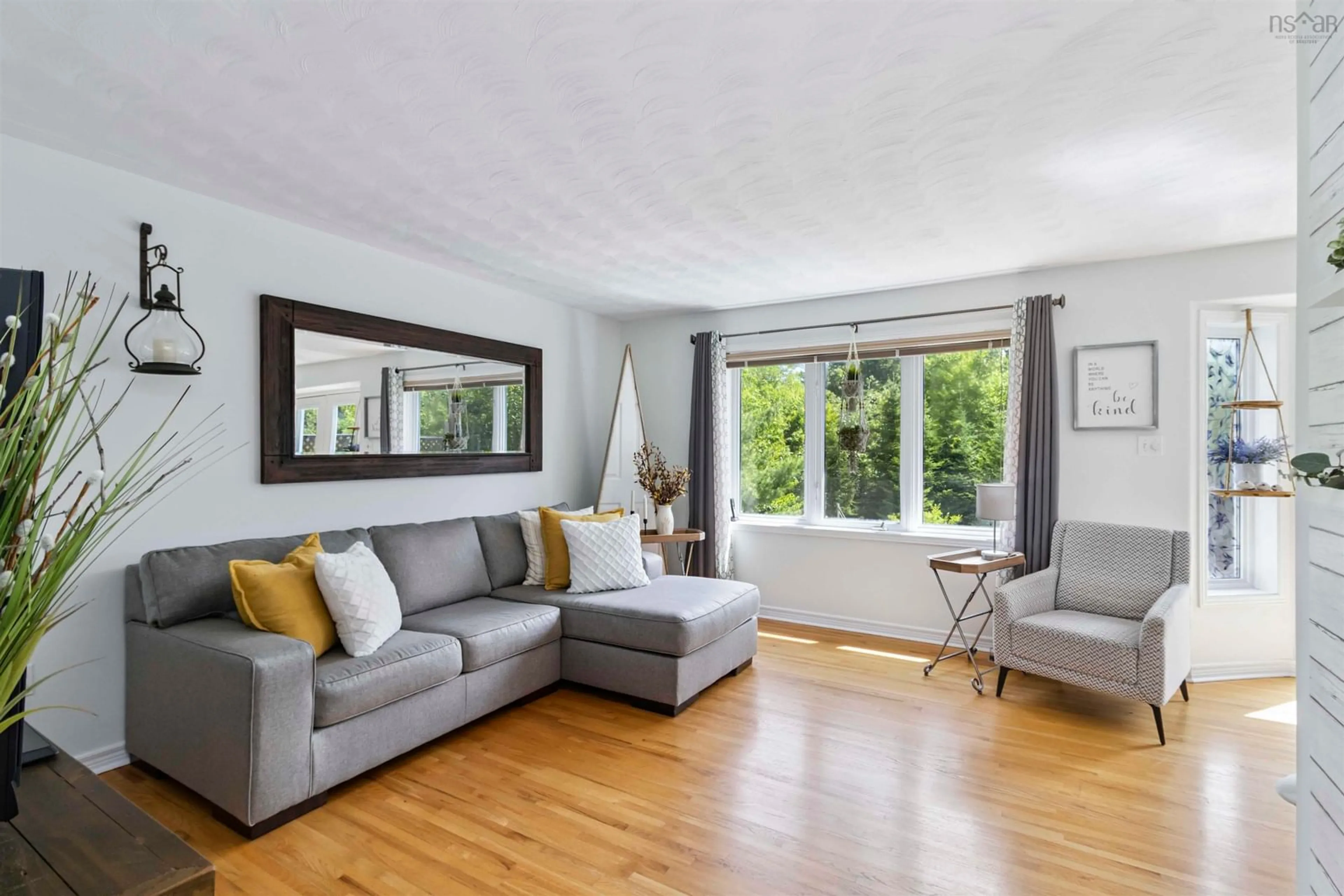 Living room with furniture, wood/laminate floor for 445 Astral Dr, Colby South Nova Scotia B2V 2V1