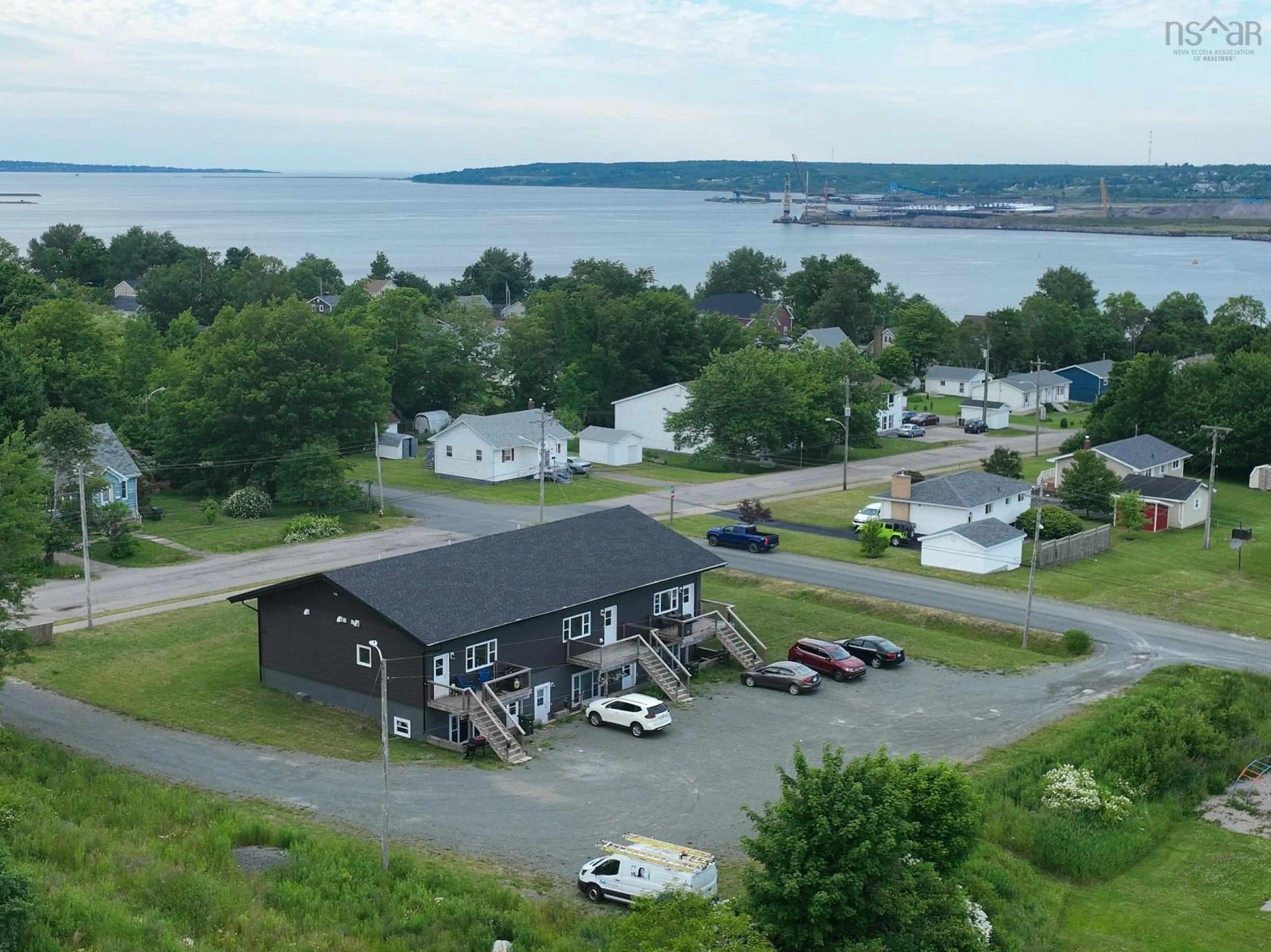 A pic from outside/outdoor area/front of a property/back of a property/a pic from drone, water/lake/river/ocean view for 95 Sunnydale Dr, Westmount Nova Scotia B1R 1J4