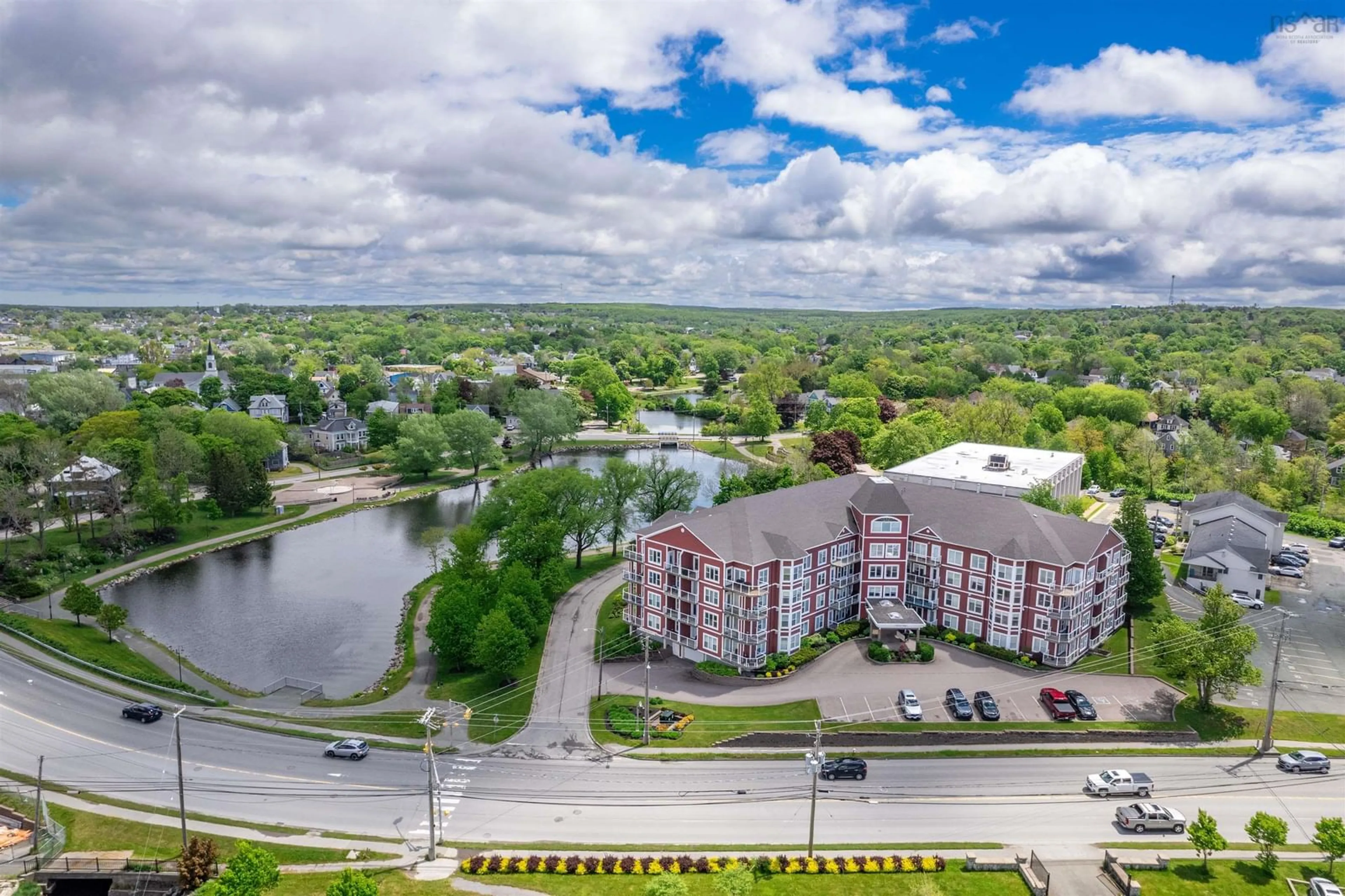 A pic from outside/outdoor area/front of a property/back of a property/a pic from drone, water/lake/river/ocean view for 69 Kings Rd #104, Sydney Nova Scotia B1S 3X4