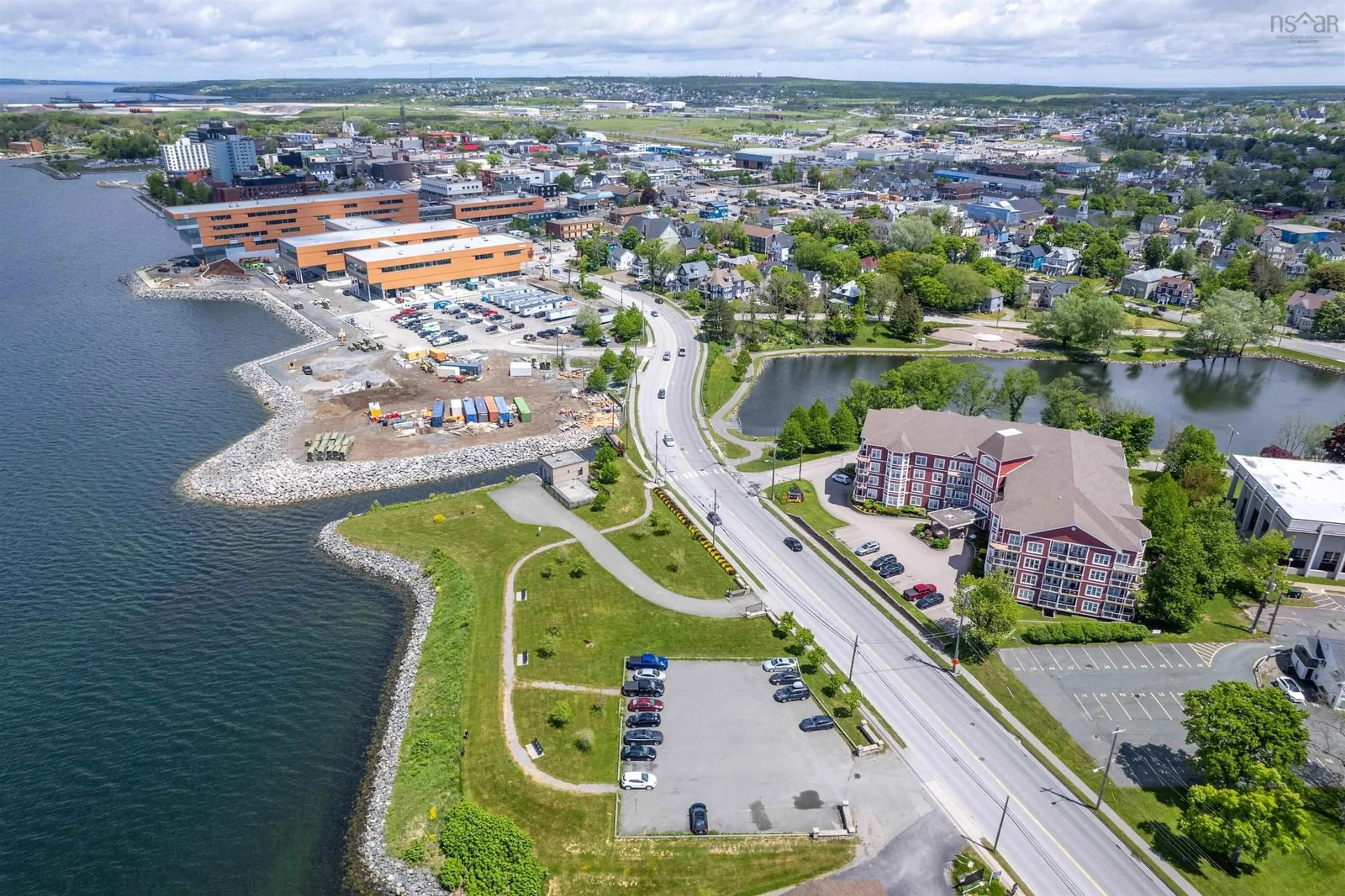 A pic from outside/outdoor area/front of a property/back of a property/a pic from drone, water/lake/river/ocean view for 69 Kings Rd #104, Sydney Nova Scotia B1S 3X4