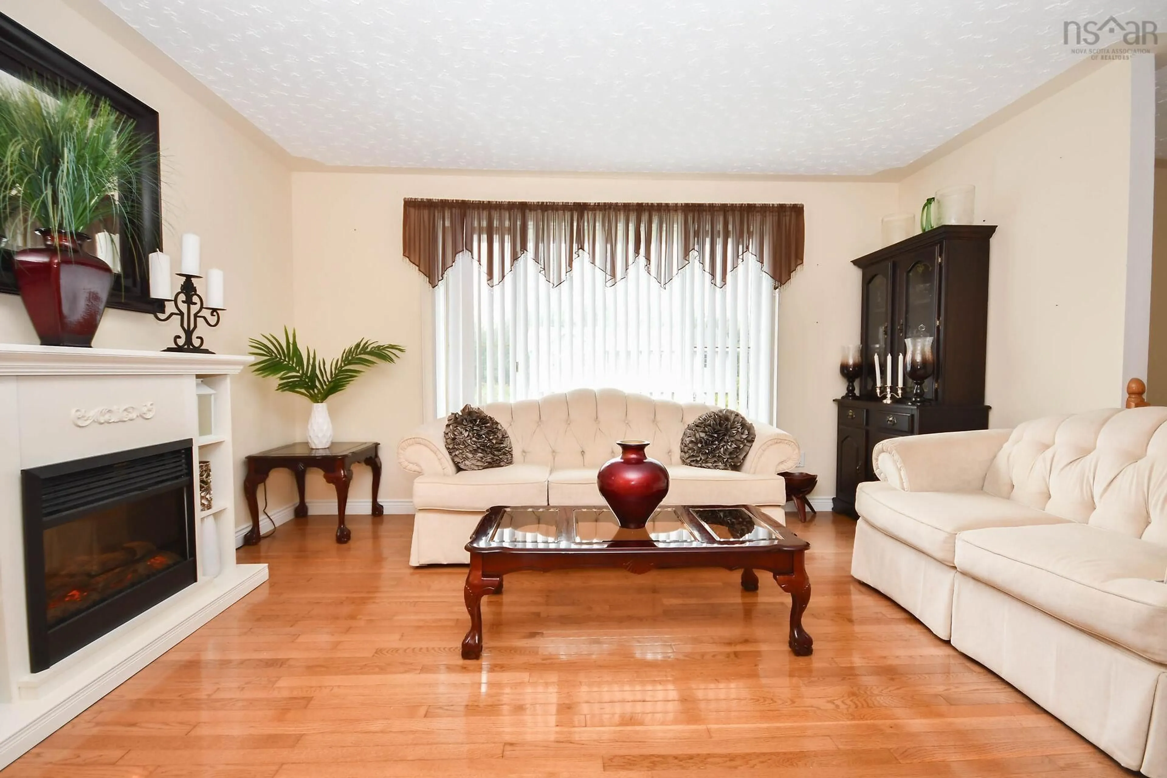 Living room with furniture, wood/laminate floor for 32 Sherwood St, Colby Nova Scotia B2V 2P4