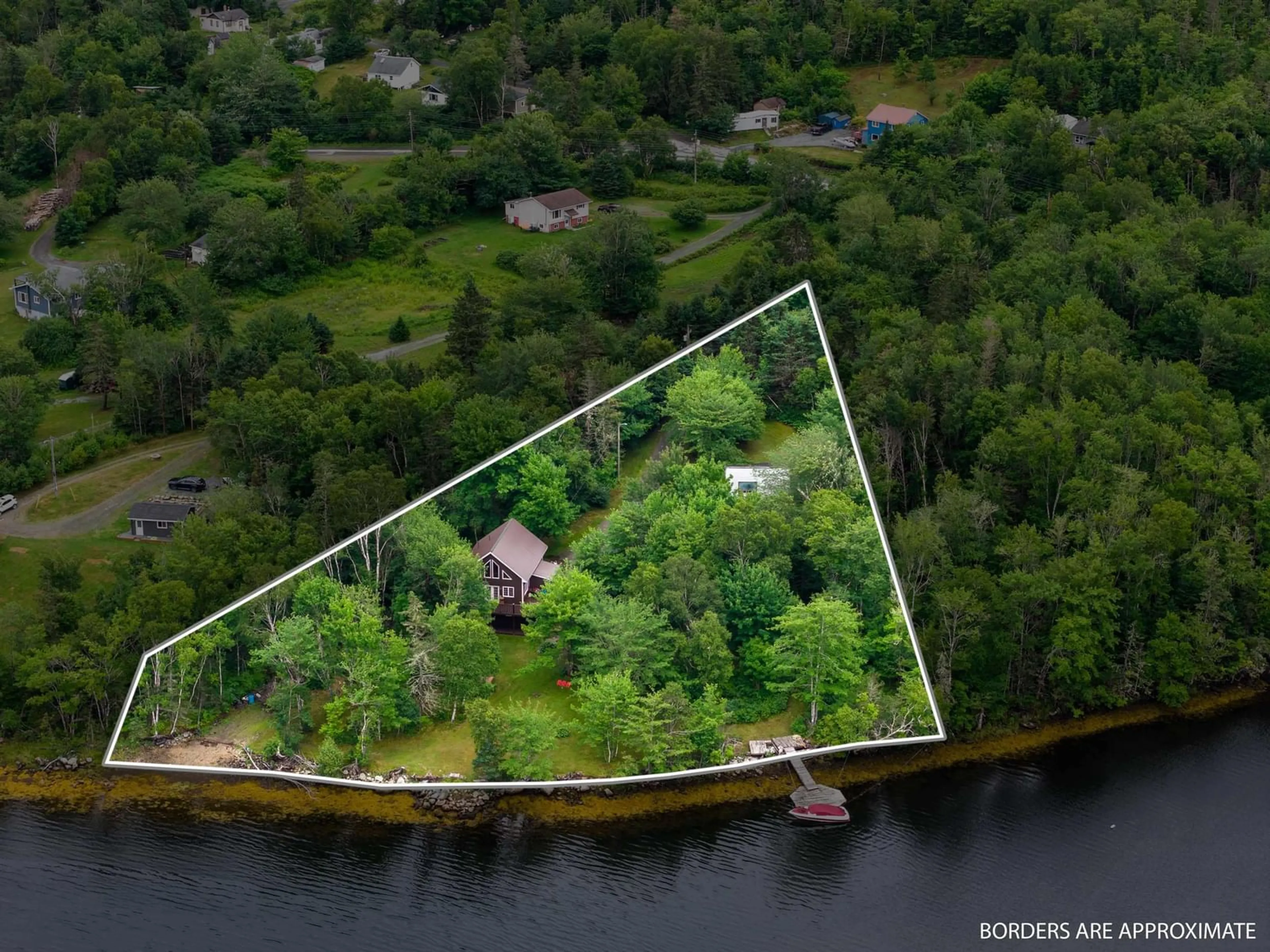 A pic from outside/outdoor area/front of a property/back of a property/a pic from drone, water/lake/river/ocean view for 59 West Side Rd, Sheet Harbour Nova Scotia B0J 3B0