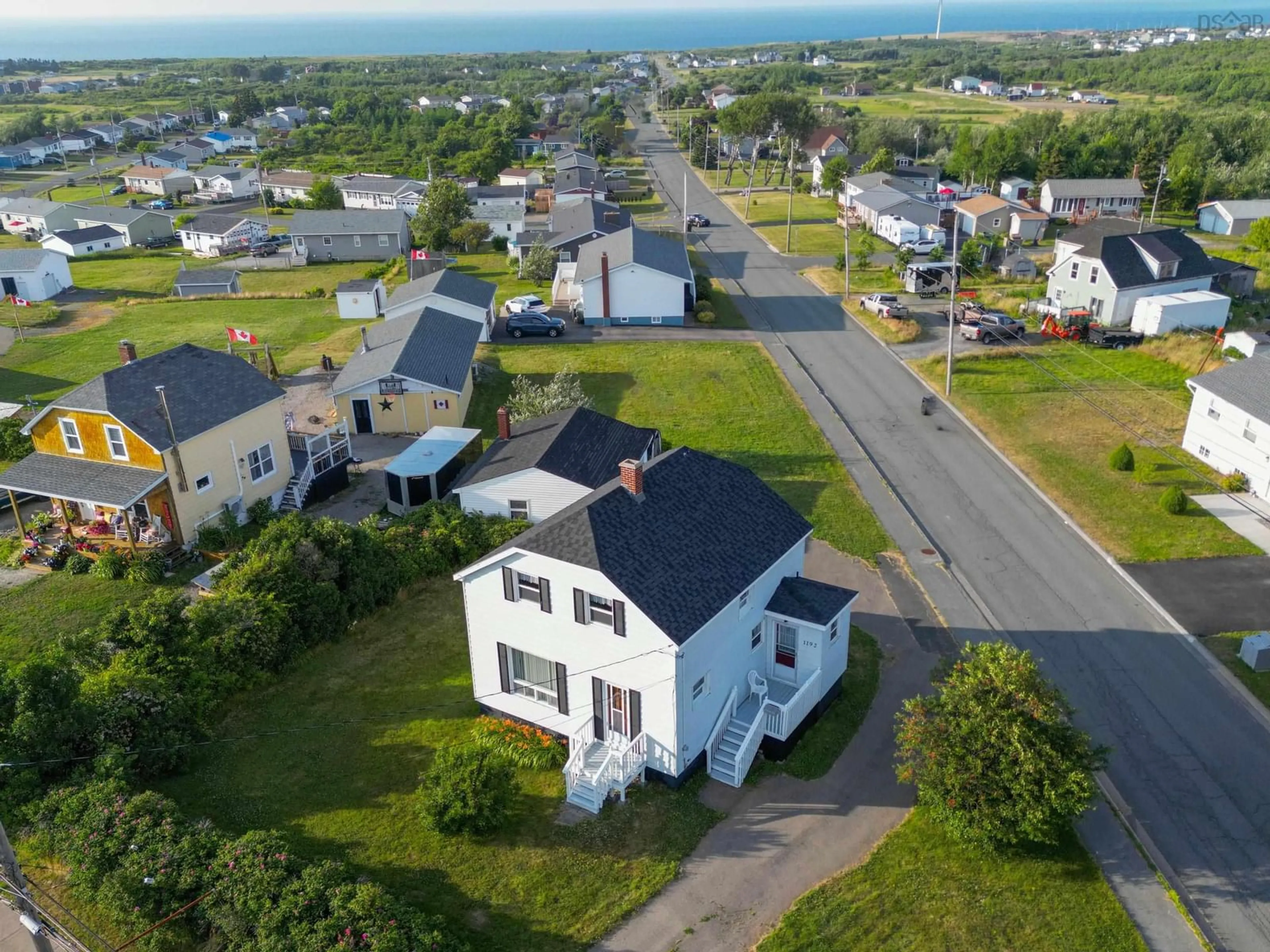 A pic from outside/outdoor area/front of a property/back of a property/a pic from drone, street for 1192 Main St, Glace Bay Nova Scotia B1A 5A2
