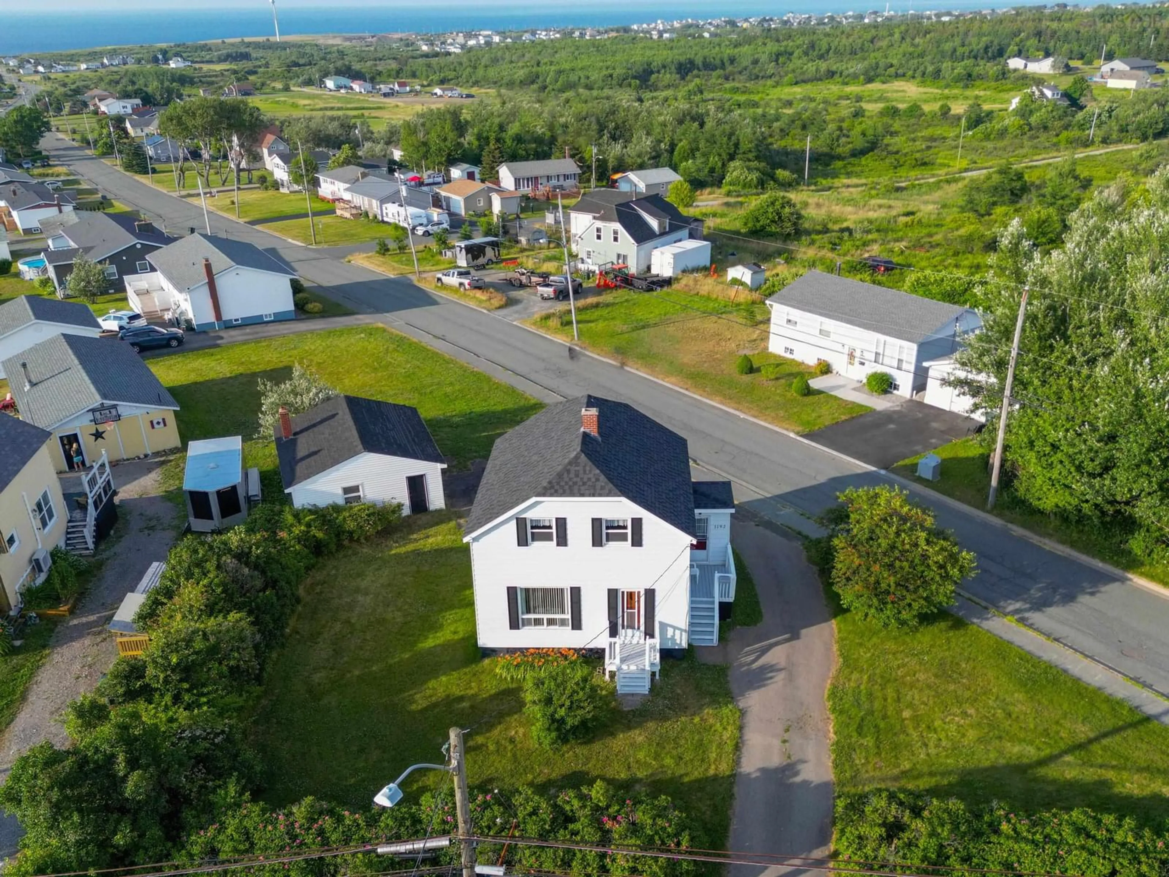 A pic from outside/outdoor area/front of a property/back of a property/a pic from drone, street for 1192 Main St, Glace Bay Nova Scotia B1A 5A2