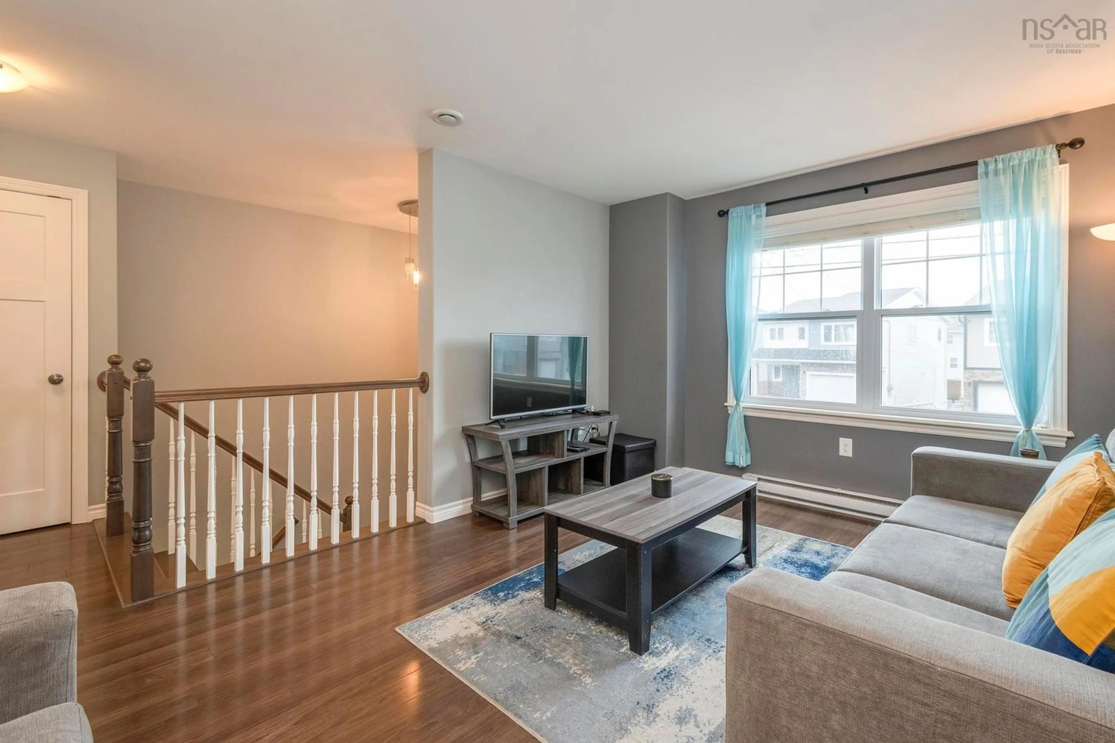 Living room with furniture, wood/laminate floor for 180 Alabaster Way, Halifax Nova Scotia B3P 0E6