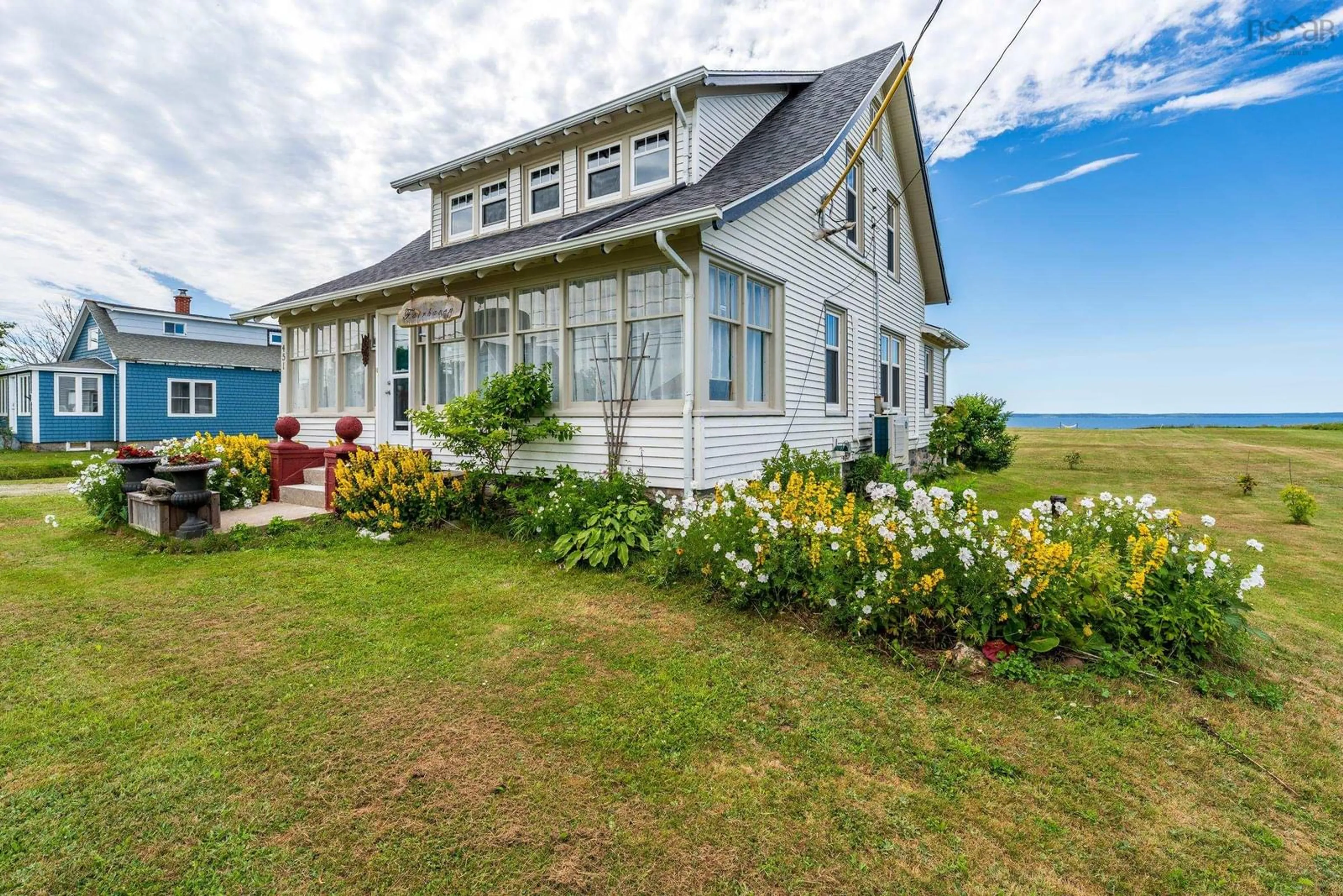 A pic from outside/outdoor area/front of a property/back of a property/a pic from drone, unknown for 451 Highway 1, Comeauville Nova Scotia B0W 2Z2