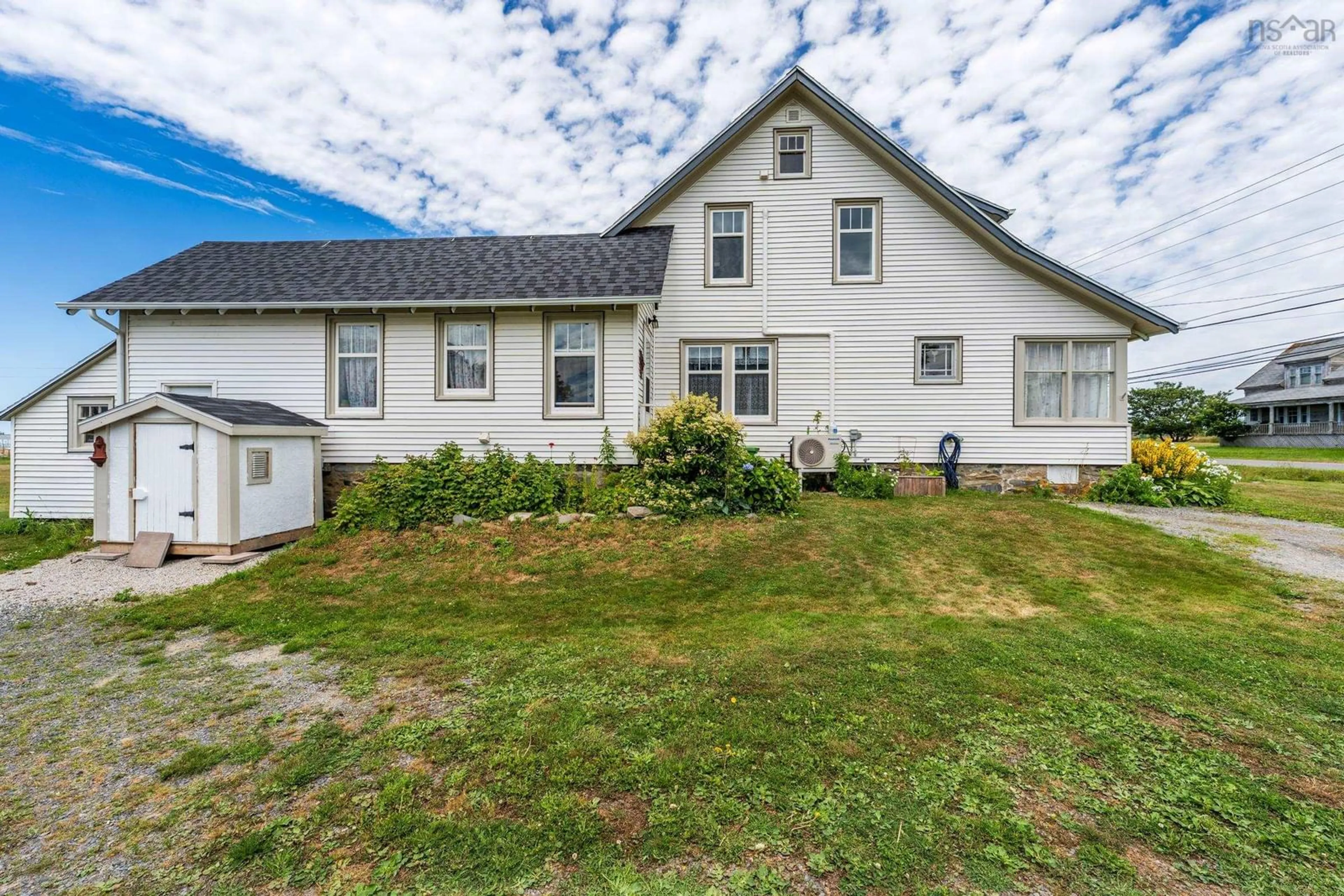 A pic from outside/outdoor area/front of a property/back of a property/a pic from drone, unknown for 451 Highway 1, Comeauville Nova Scotia B0W 2Z2
