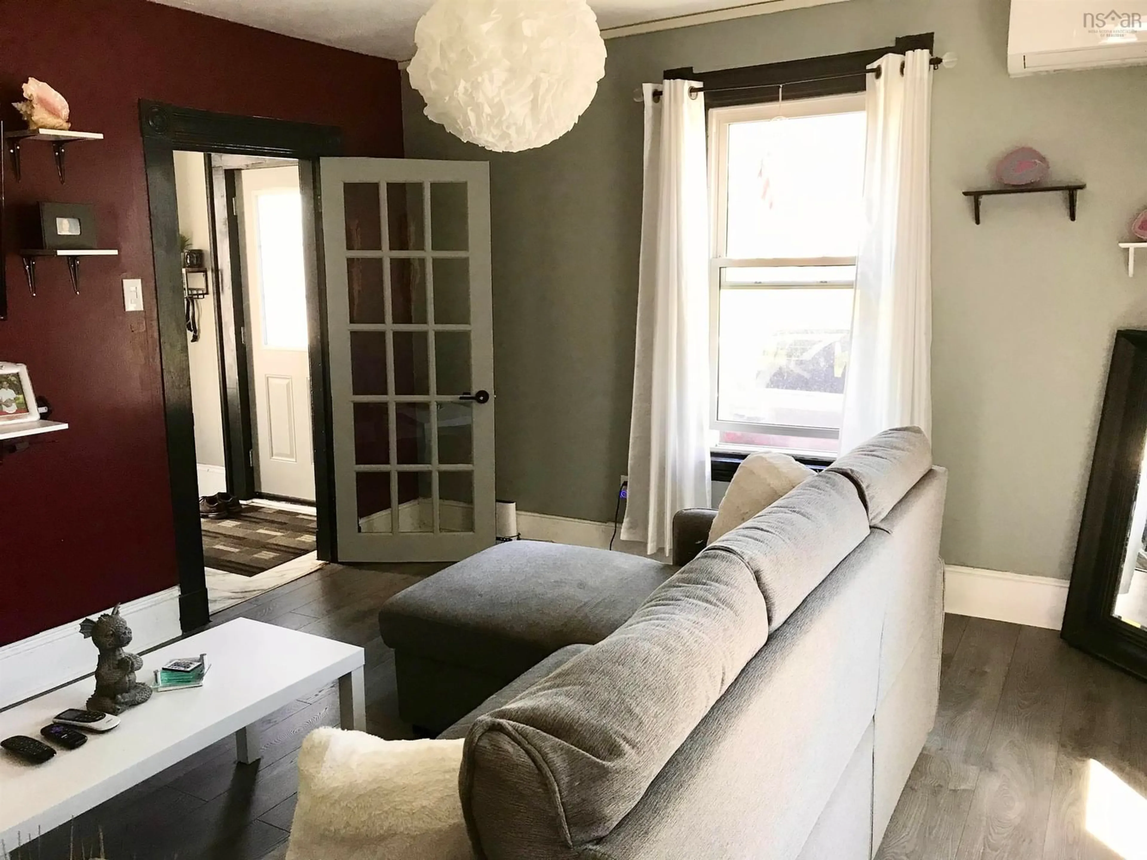 Living room with furniture, unknown for 31 Barnard St, Yarmouth Nova Scotia B5A 3T4