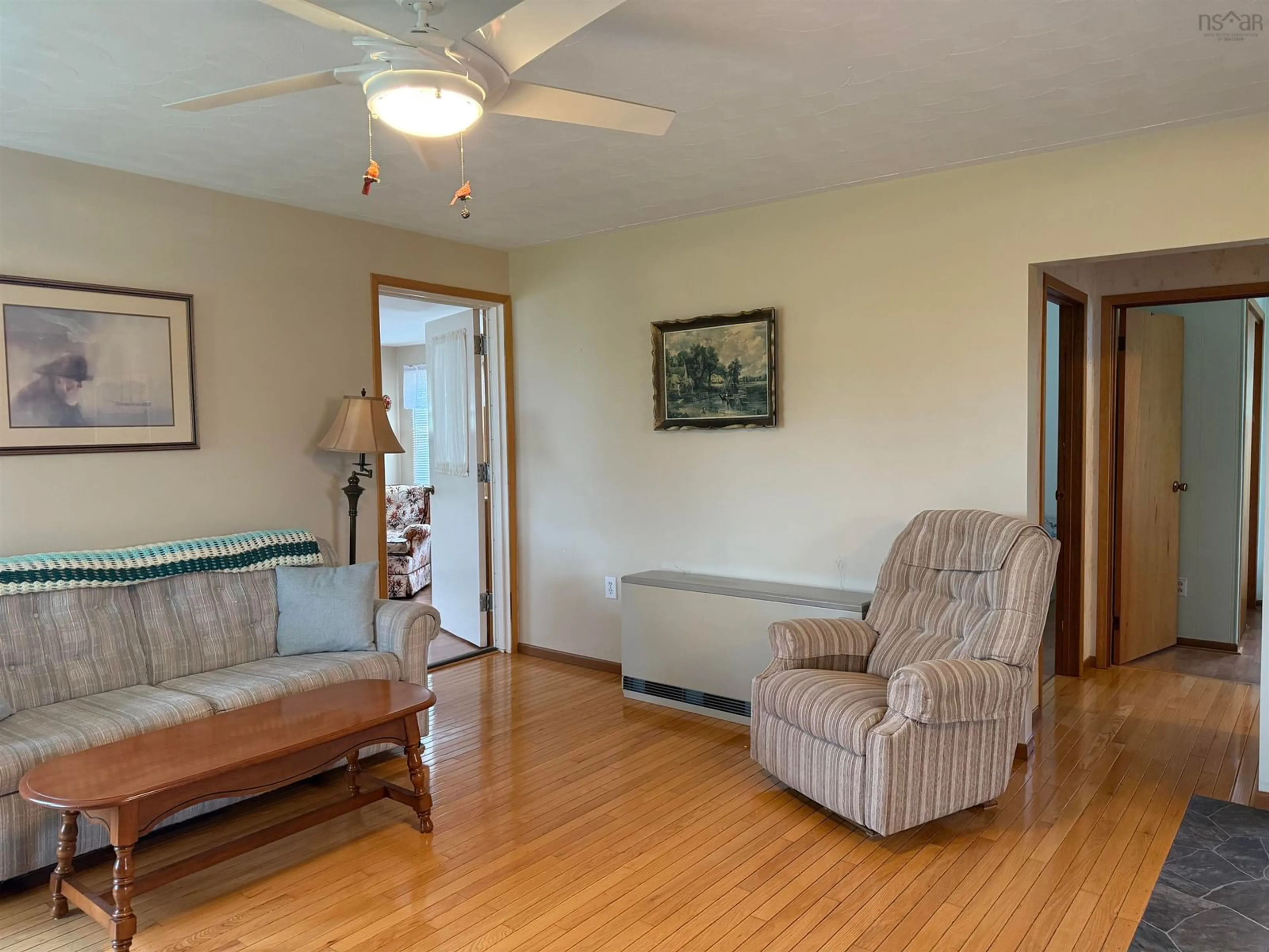 Living room with furniture, wood/laminate floor for 45 Murdocks Lane, Ponds Nova Scotia B0K 1G0