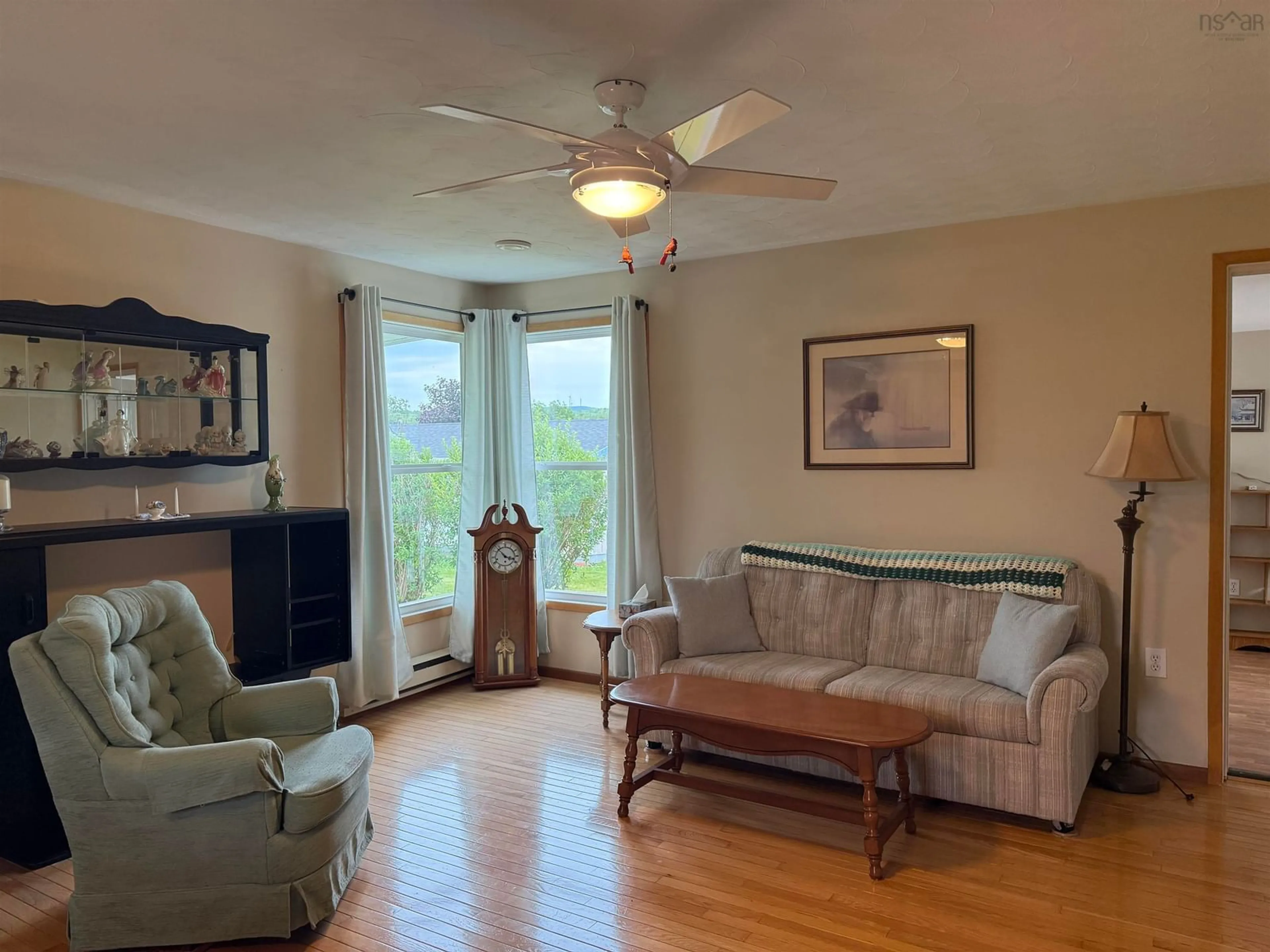 Living room with furniture, wood/laminate floor for 45 Murdocks Lane, Ponds Nova Scotia B0K 1G0
