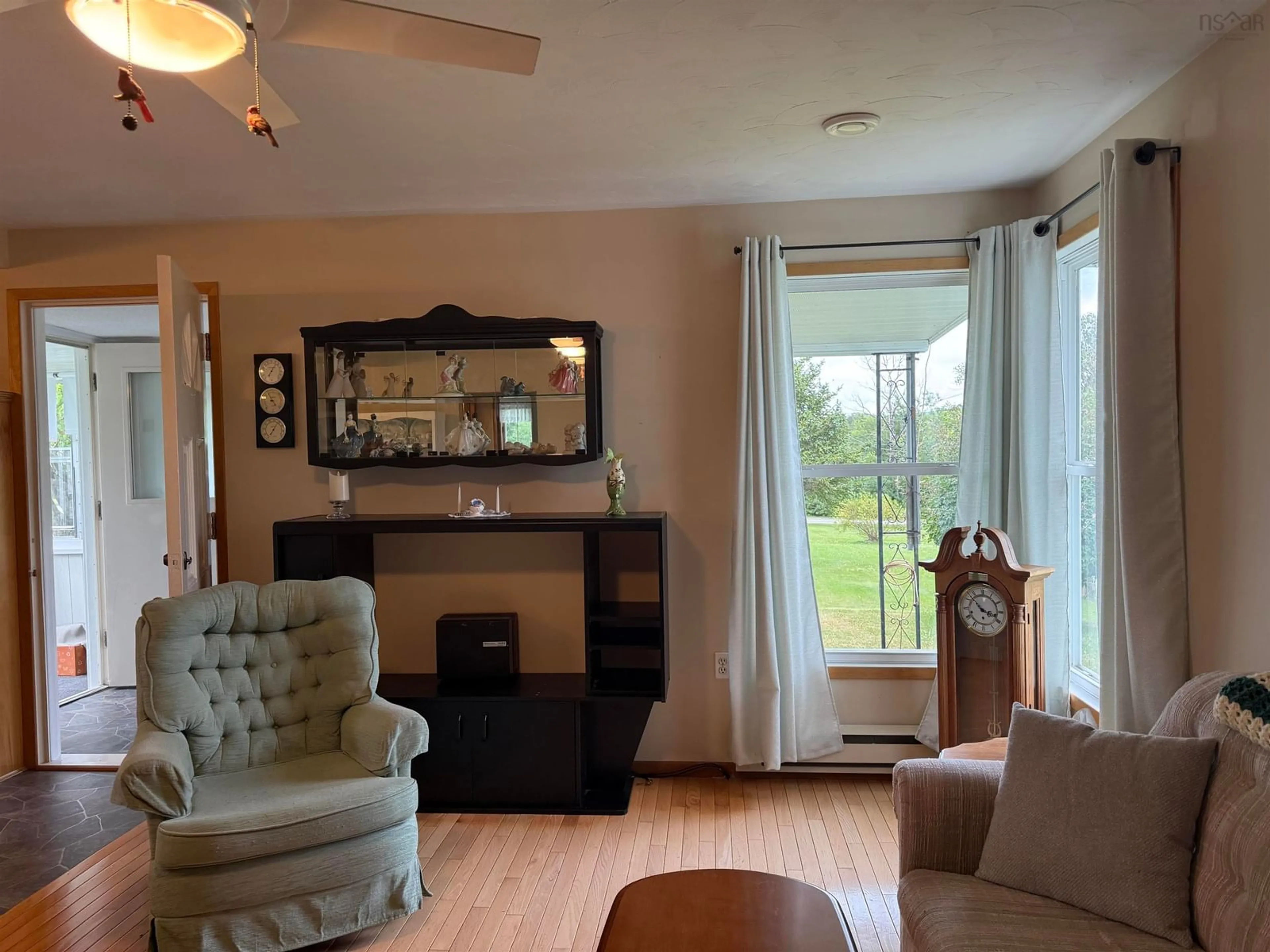Living room with furniture, wood/laminate floor for 45 Murdocks Lane, Ponds Nova Scotia B0K 1G0