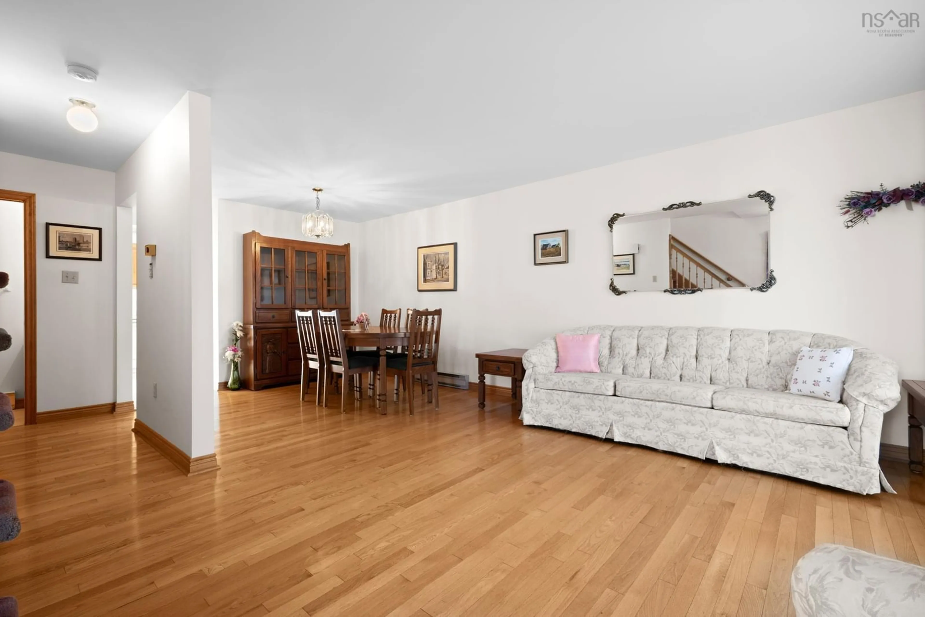 Living room with furniture, wood/laminate floor for 19 Herbert Rd, Halifax Nova Scotia B3N 3C7